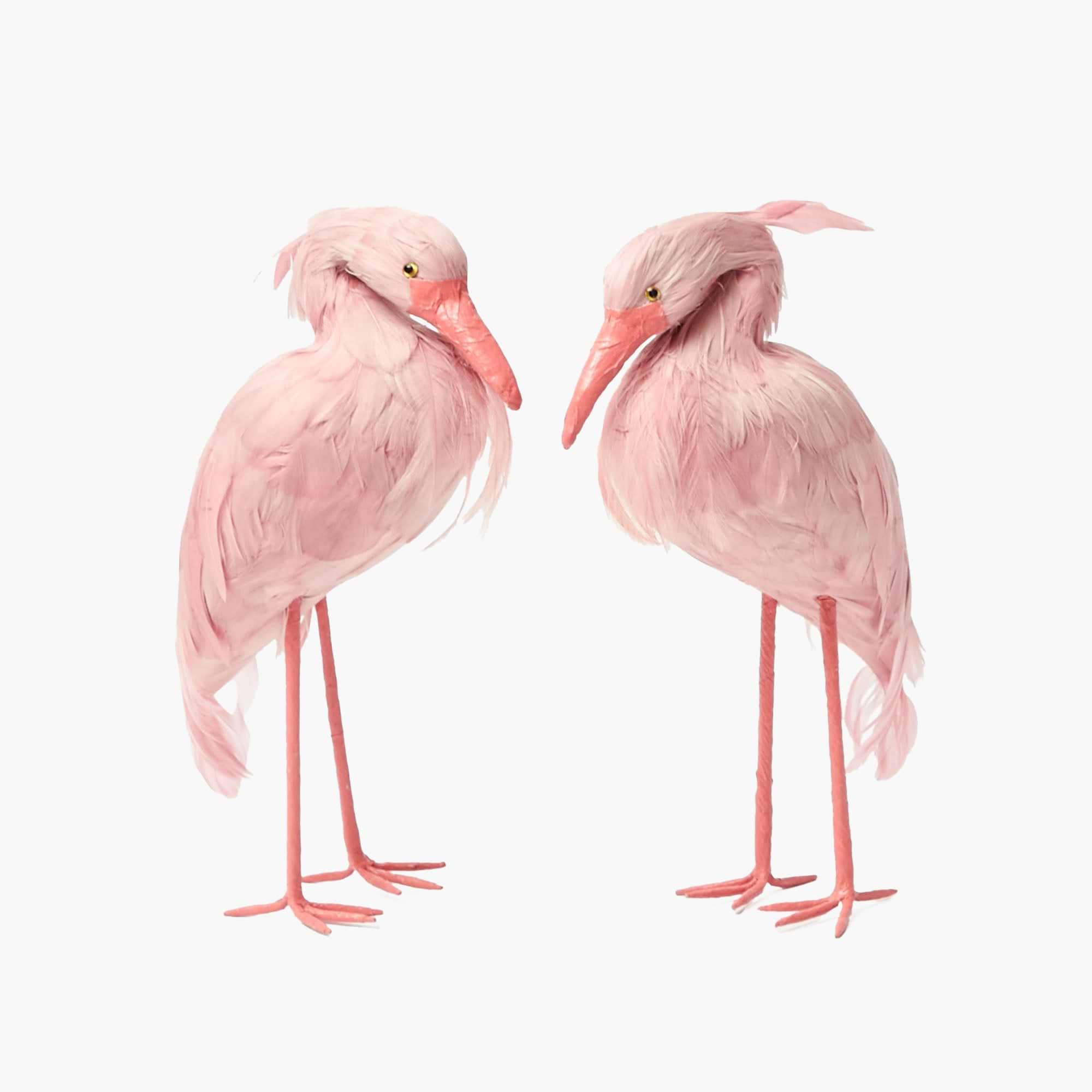 Two pink flamingo figurines on a white background