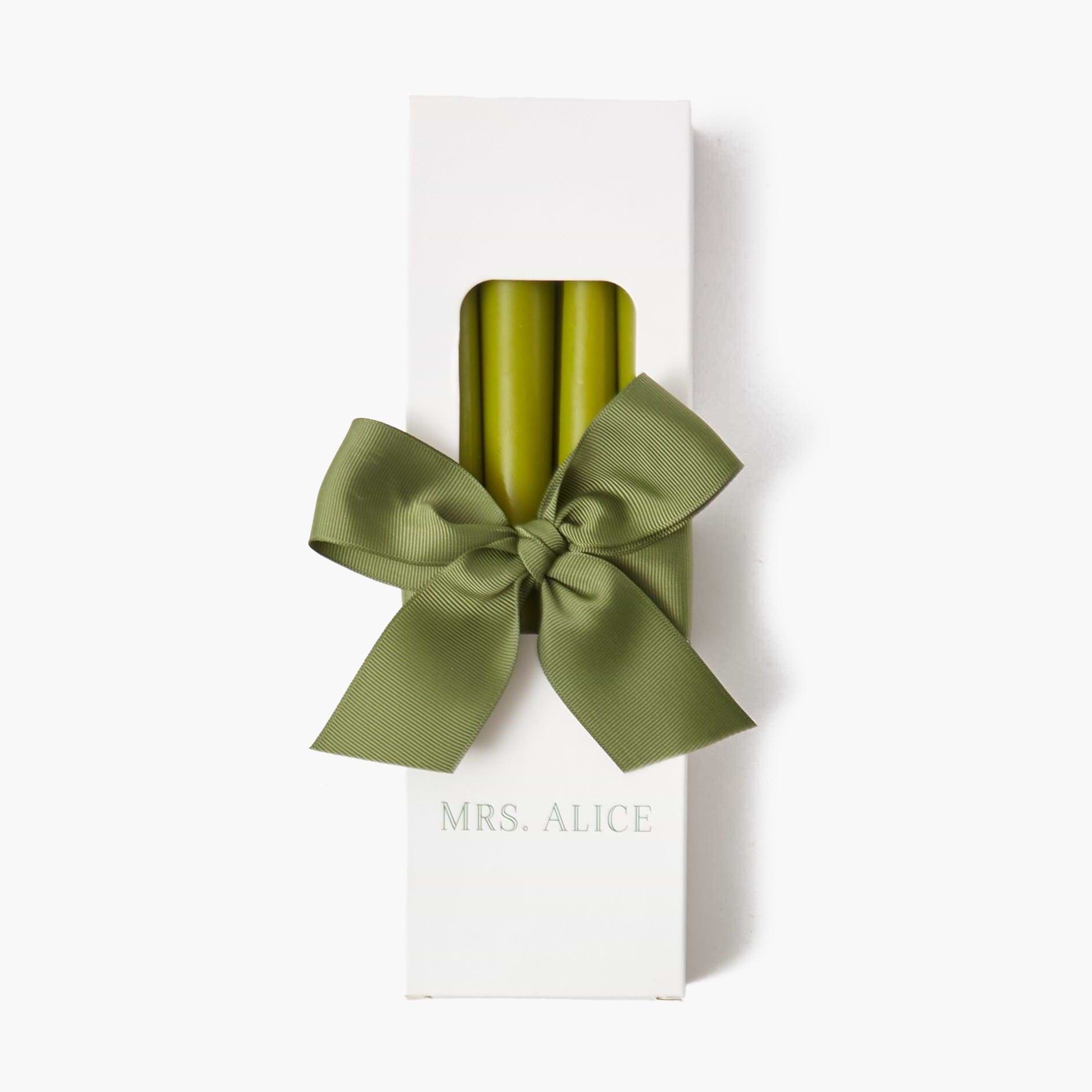 Illuminate your space with the lively glow of Apple Green Candles in this charming set of 8.
