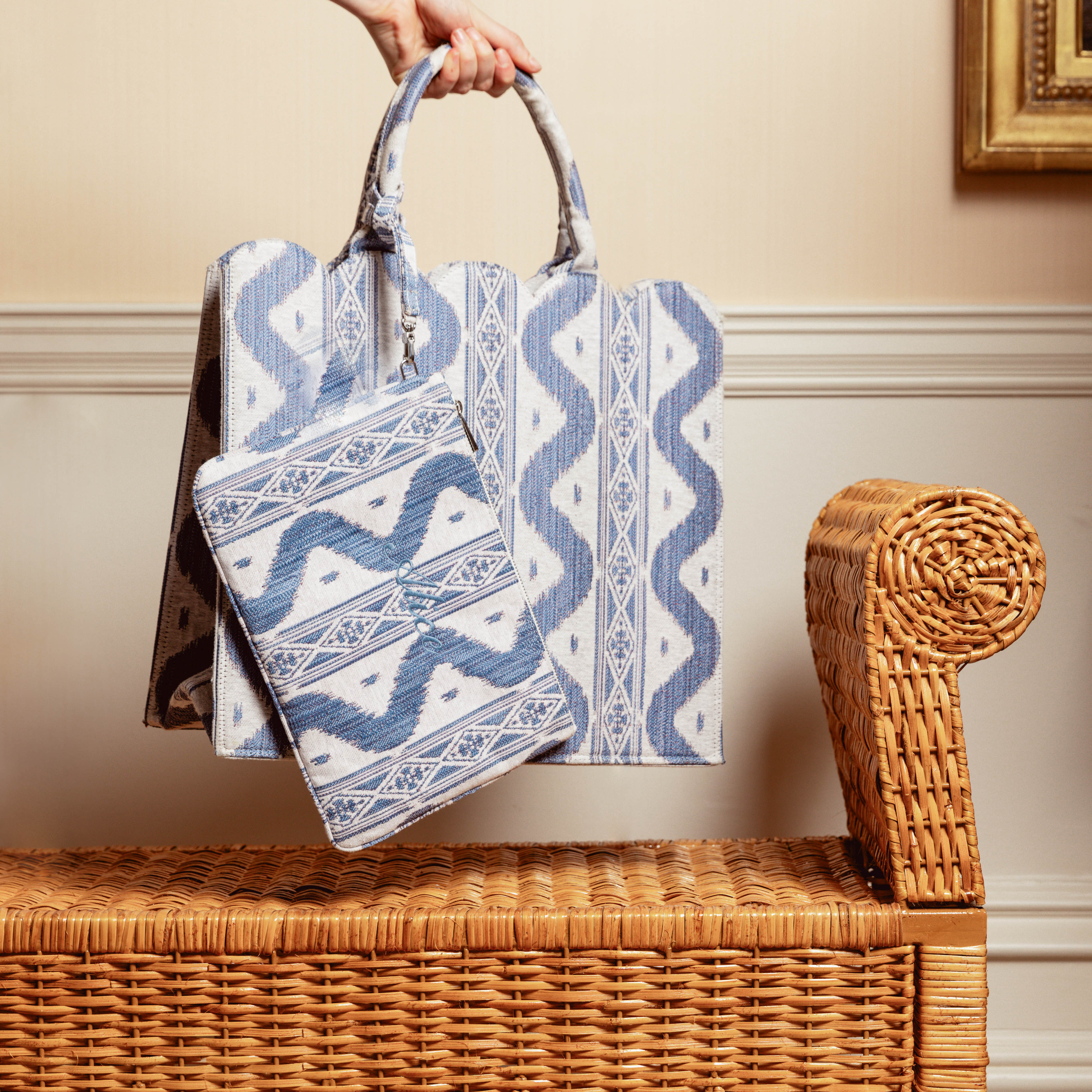Elevate your look with "The Tote-ally Fabulous" Giftscape, complete with the Blue Ikat Pochette (Zip fastening) for a touch of sophistication.
