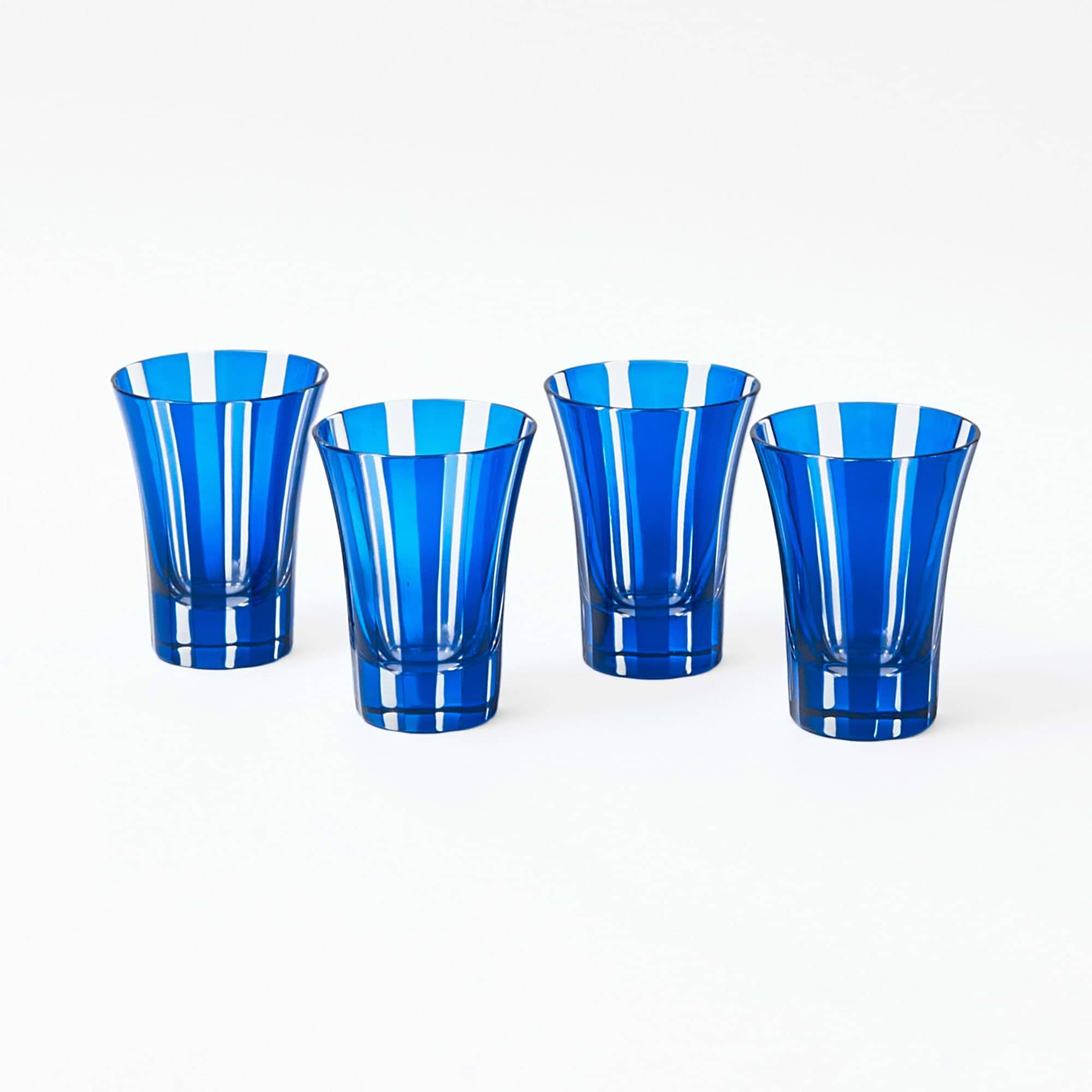 Four Positano glasses featuring a striking royal blue shade.