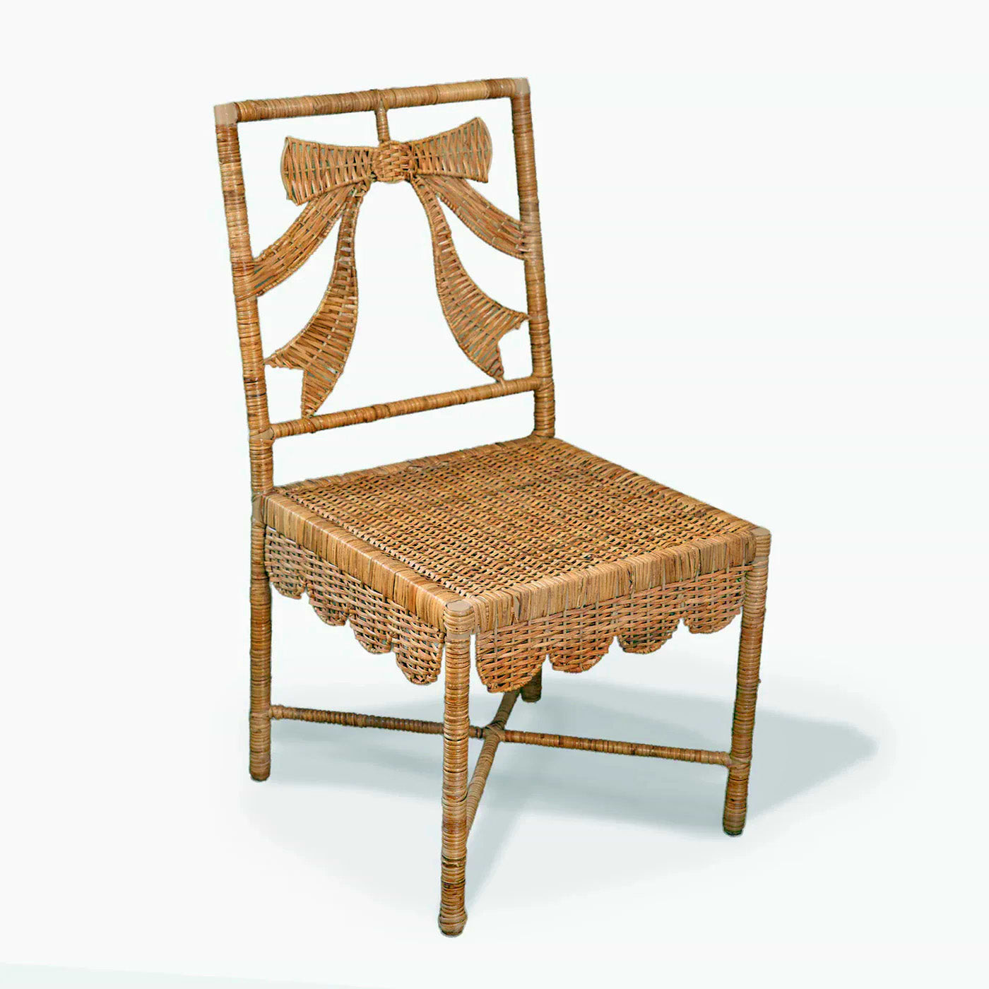 Rattan chair with decorative bow on a white background