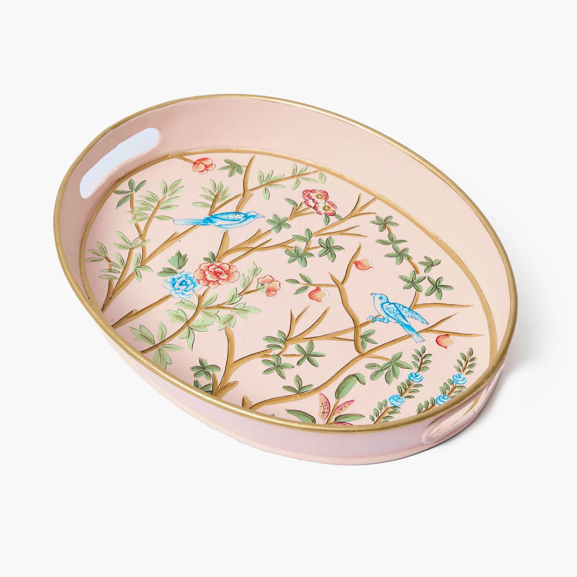 A small pink oval-shaped tole tray with a floral pattern and gold trim.