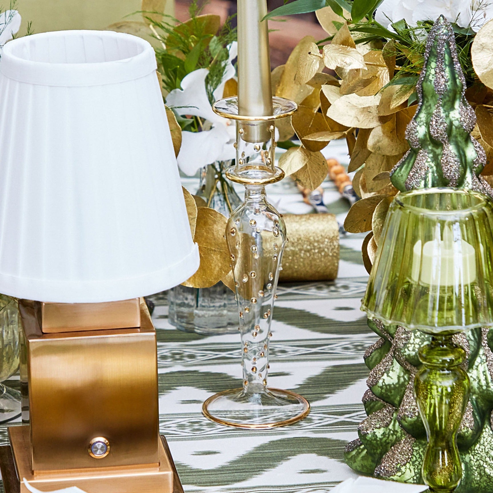 Elevate your holiday festivities with the Joy Gold Candlescape, a captivating arrangement that radiates a sense of celebration.