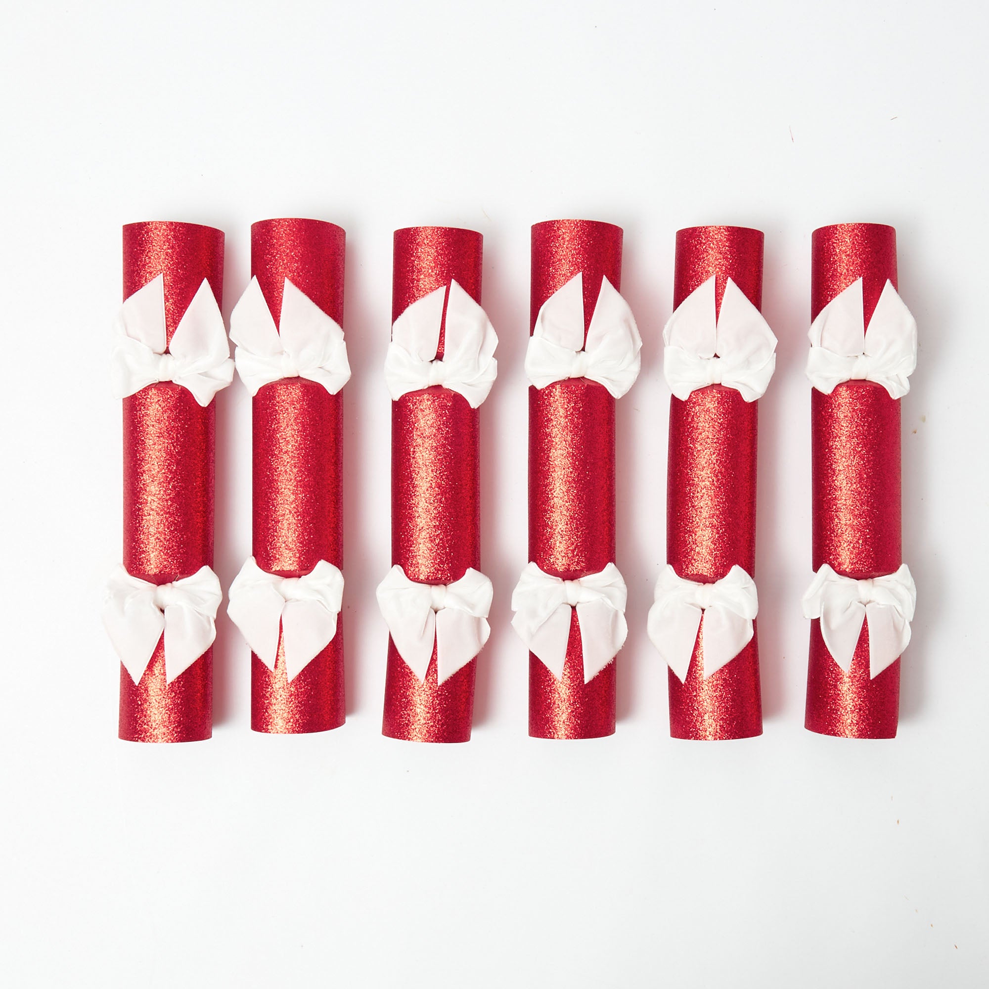 Share the gift of laughter and merriment with these Red Glitter Crackers.