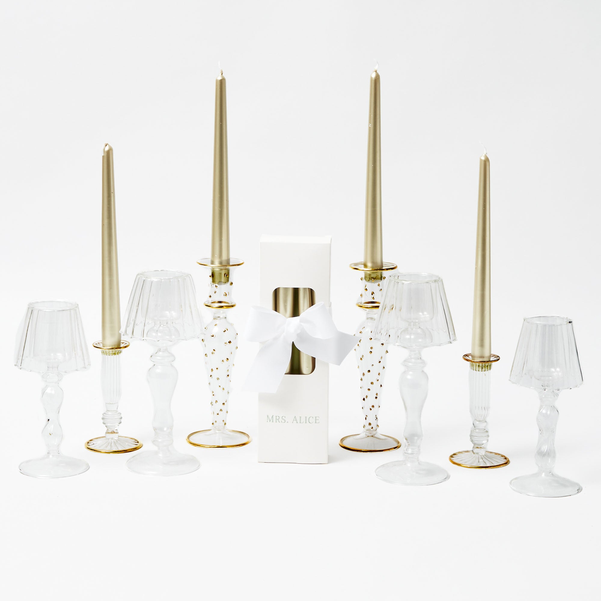 Illuminate your space with the Joy Gold Candlescape, a stunning arrangement that exudes warmth and joy.