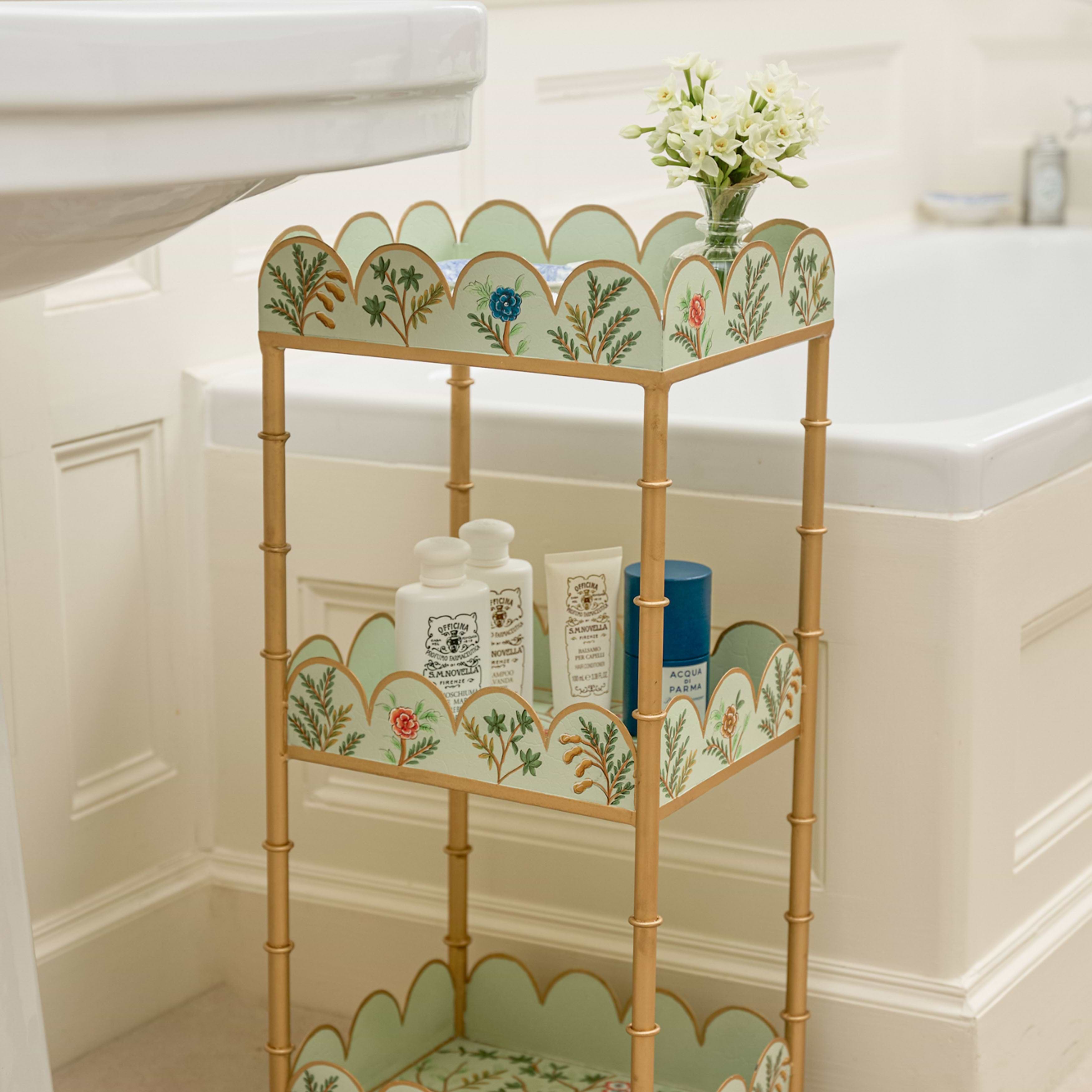 Decorative metal shelf with floral patterns in a bathroom setting