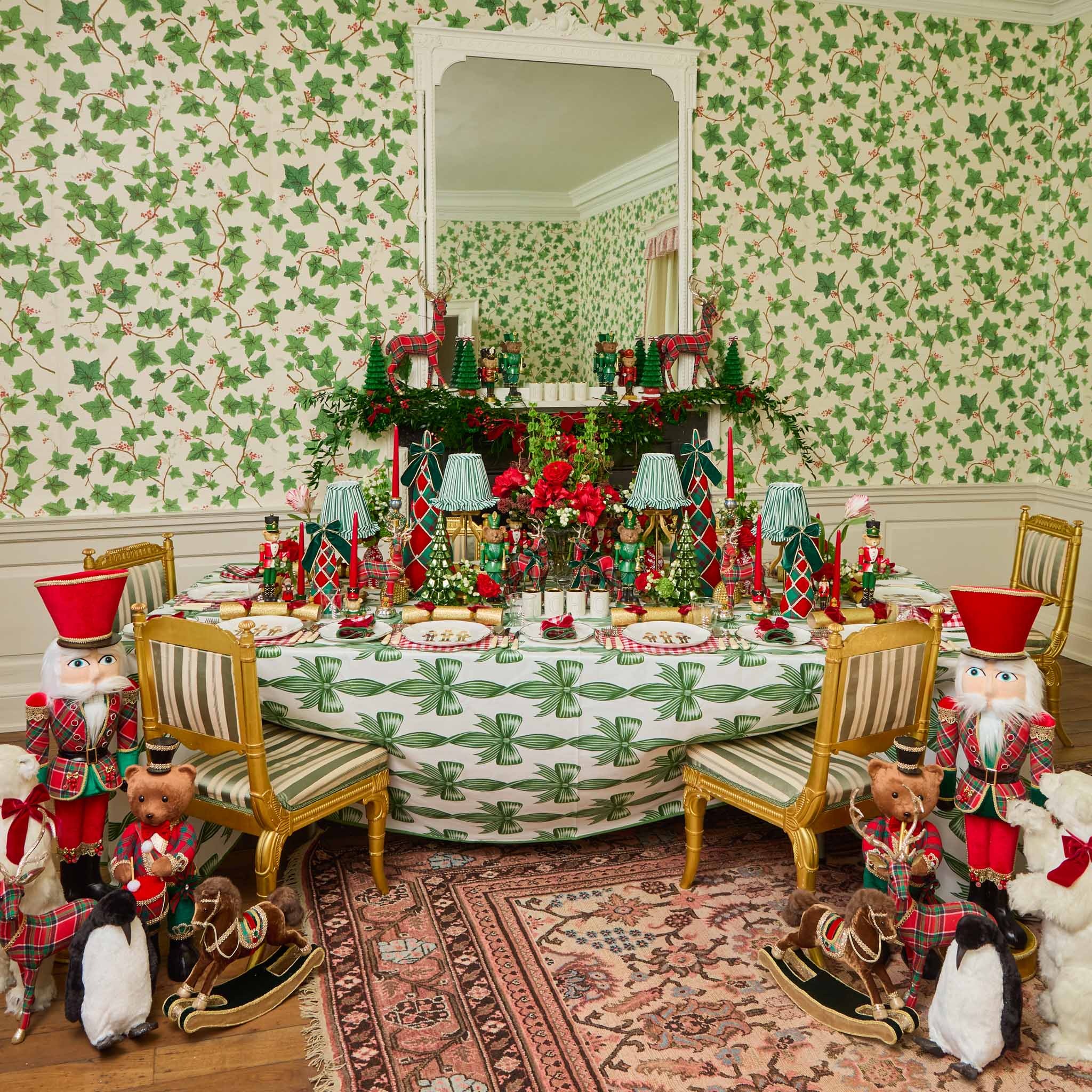 Decorative Christmas-themed room with a table set for a meal, surrounded by festive decorations and wallpaper.
