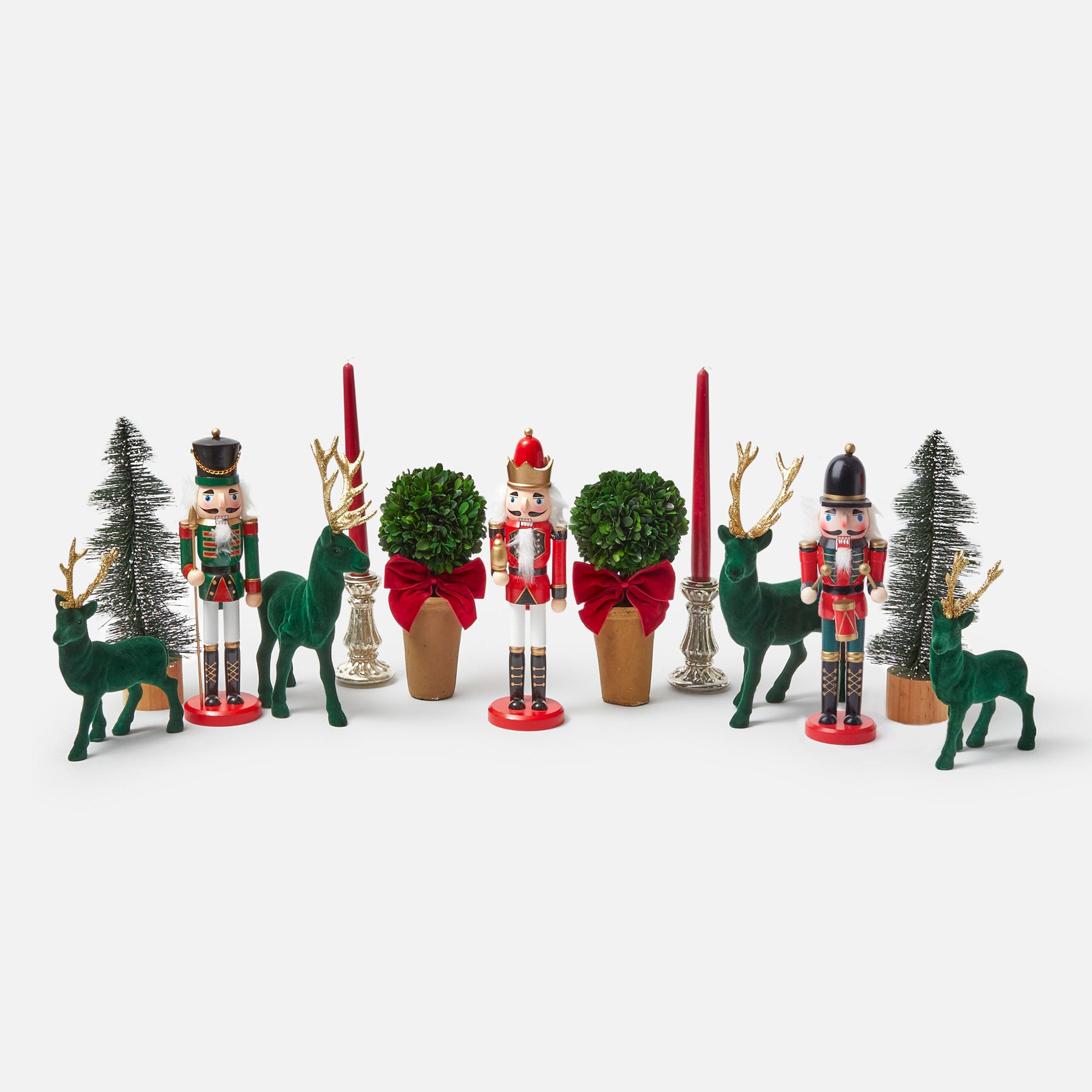 Create a festive and inviting atmosphere with the Jolly Nutcracker Trio, a charming collection of nutcracker figurines that brings a sense of nostalgia and merriment to your holiday decor.