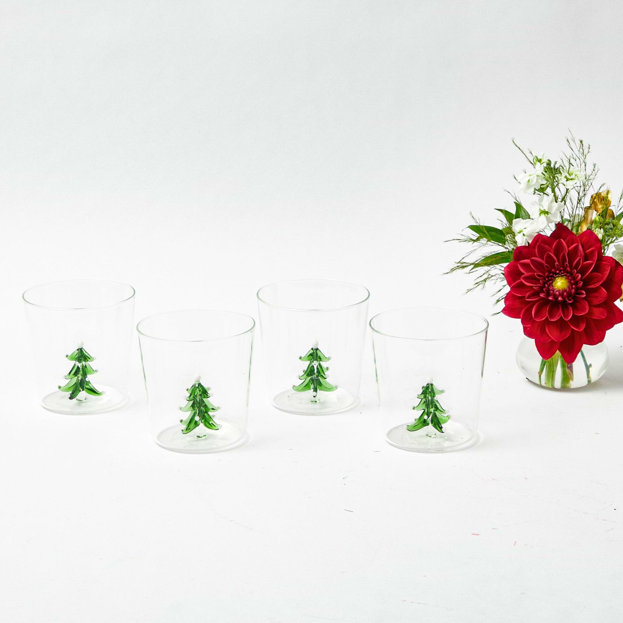 Bring the joy of the season to your home with this delightful Christmas Tree Jug and Glasses ensemble.