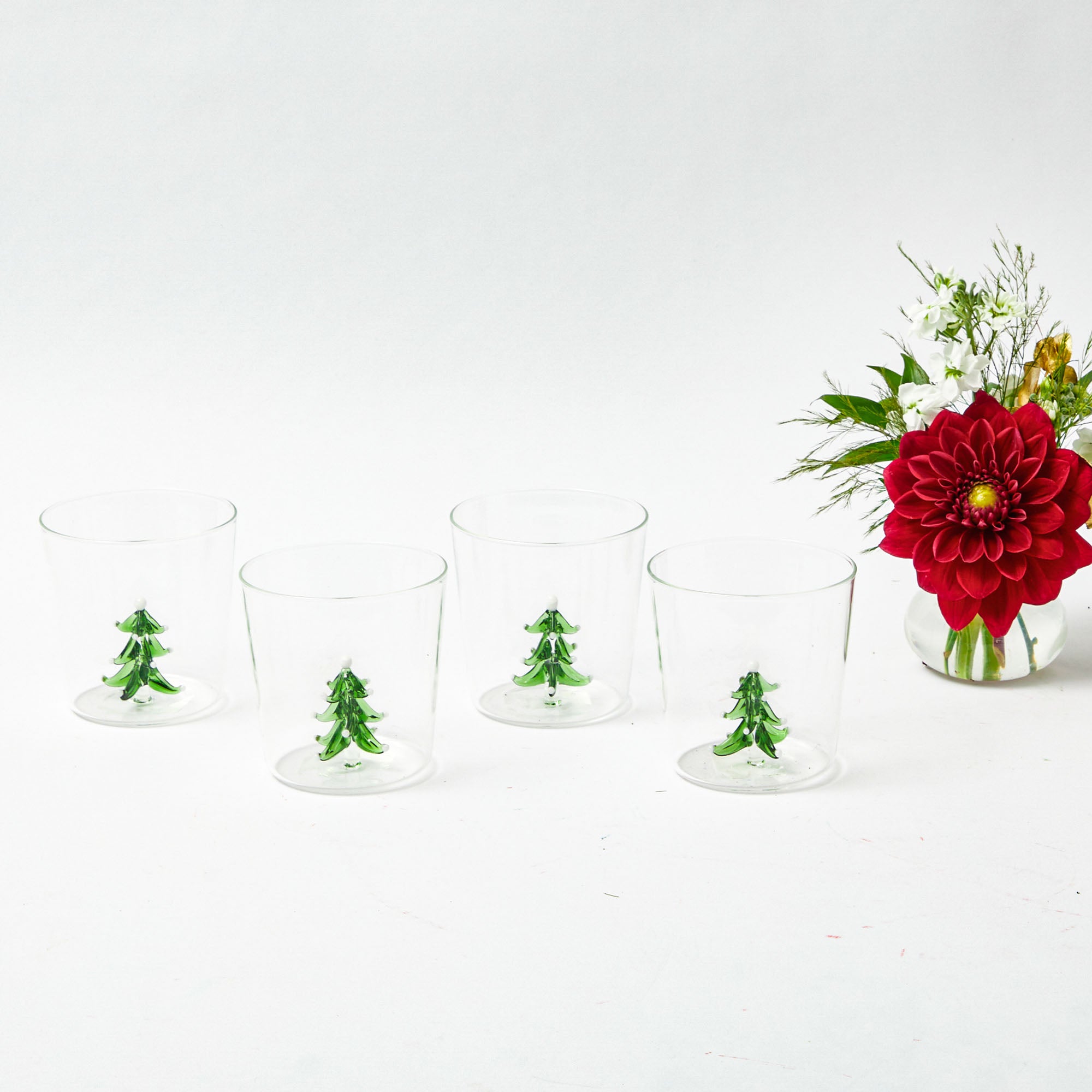Bring the joy of the season to your home with this delightful Christmas Tree Jug and Glasses ensemble.