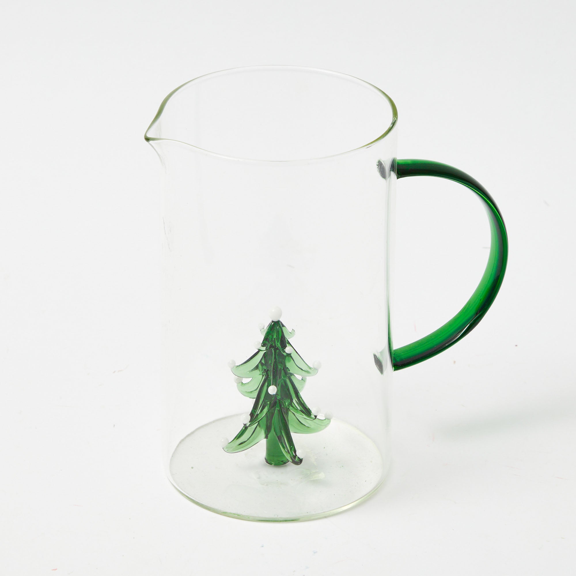 Serve your favorite beverages in these cheerful Christmas Tree Jug and Glasses.