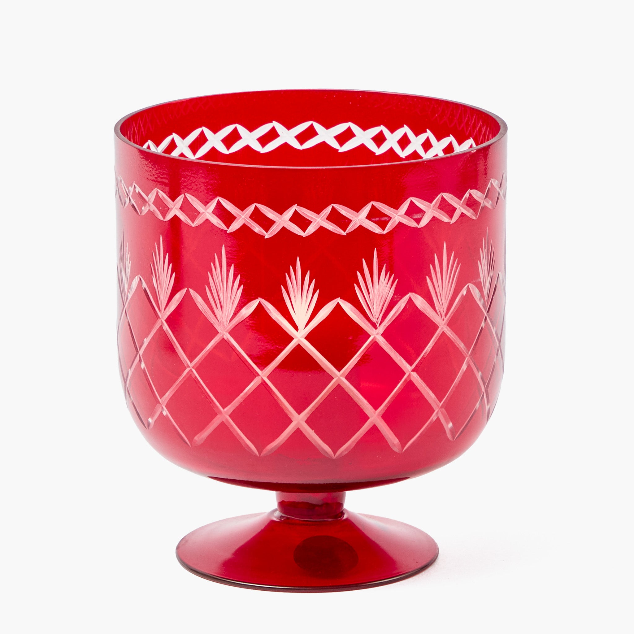 Red glass vase  with white geometric patterns on a white background