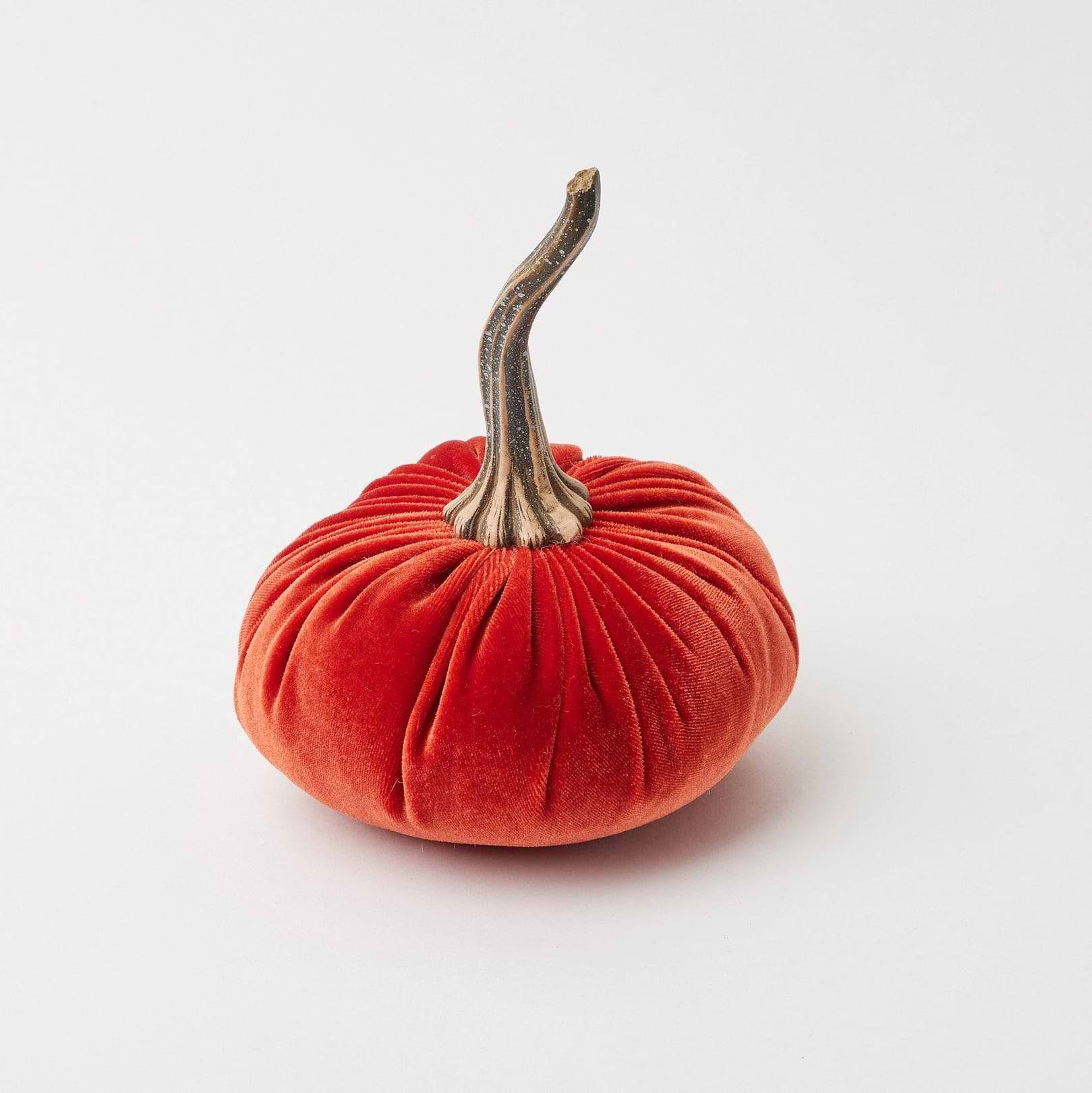 Trio of velvet pumpkins, portraying a family unit in varying sizes.