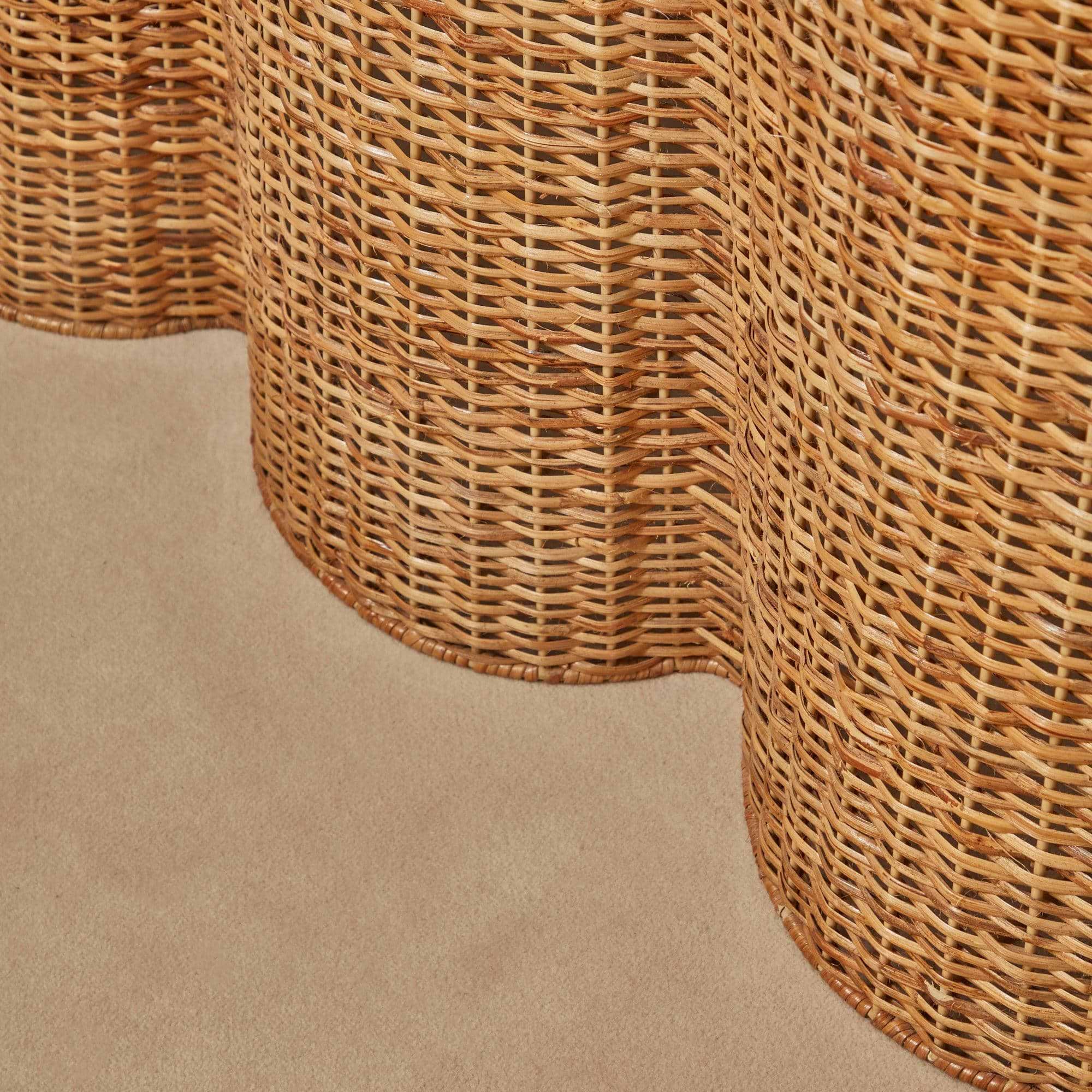 Make your home more inviting with the Vivienne Rattan Scalloped Console Table, a stunning addition that captures the essence of nature-inspired beauty and style.