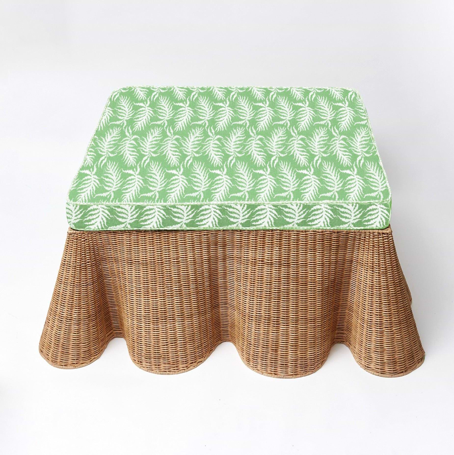 Make your living space more inviting, versatile, and chic with the playful charm of the Vivienne Rattan Scalloped Ottoman, a delightful addition that captures the spirit of coastal living, additional comfort, and a touch of natural sophistication in your home.