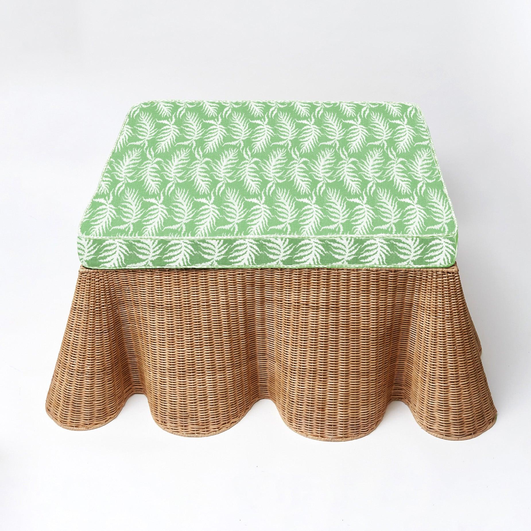 Make your living space more inviting, versatile, and chic with the playful charm of the Vivienne Rattan Scalloped Ottoman, a delightful addition that captures the spirit of coastal living, additional comfort, and a touch of natural sophistication in your home.