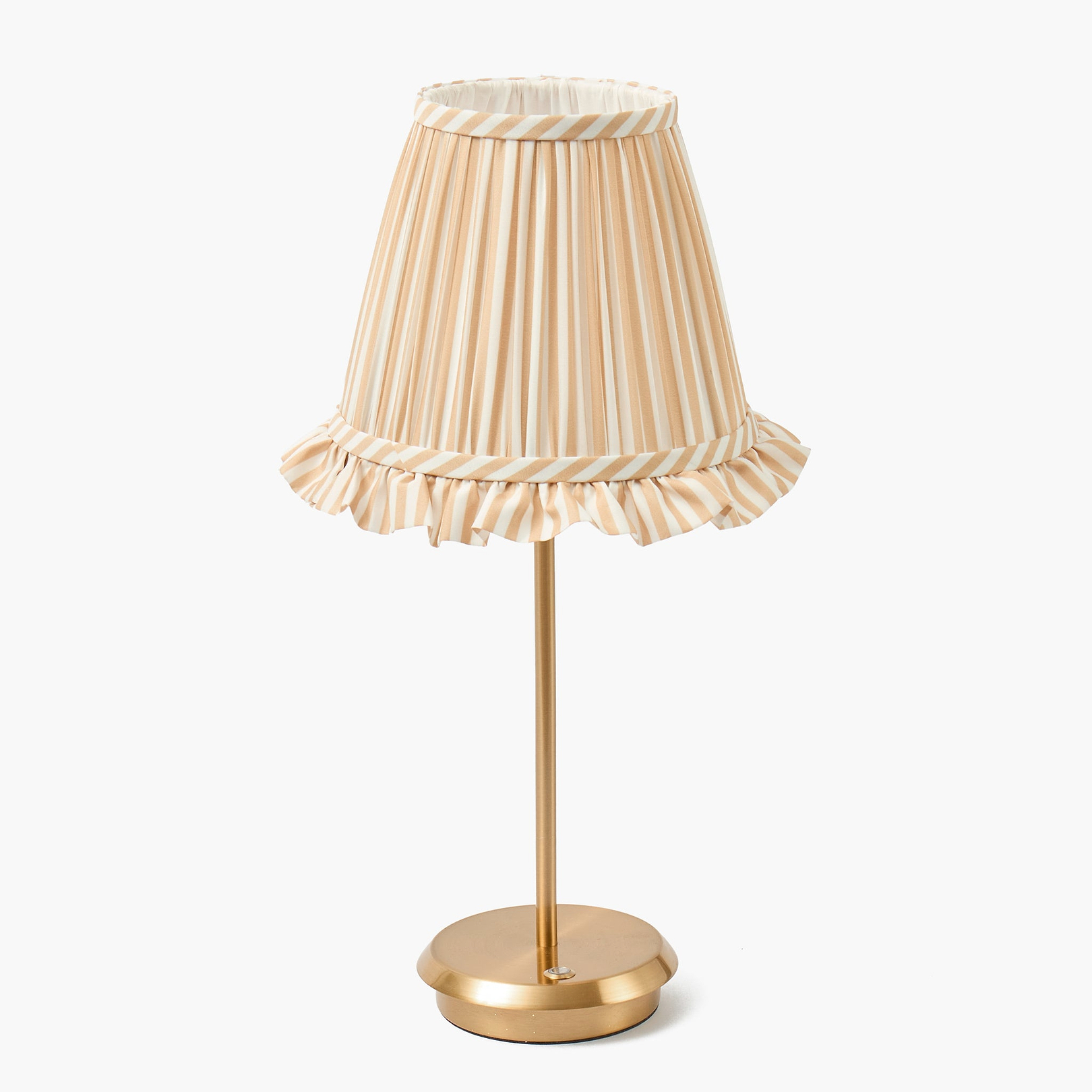 Table lamp with a striped beige and white shade on a white background