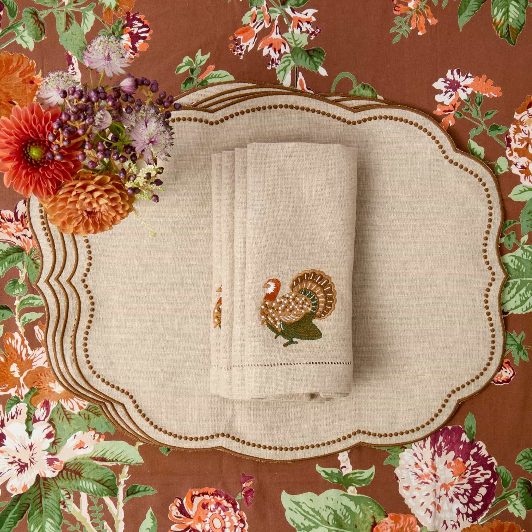 Napkin with embroidered turkey design on Mrs Alice's Aurelia Tablecloth.