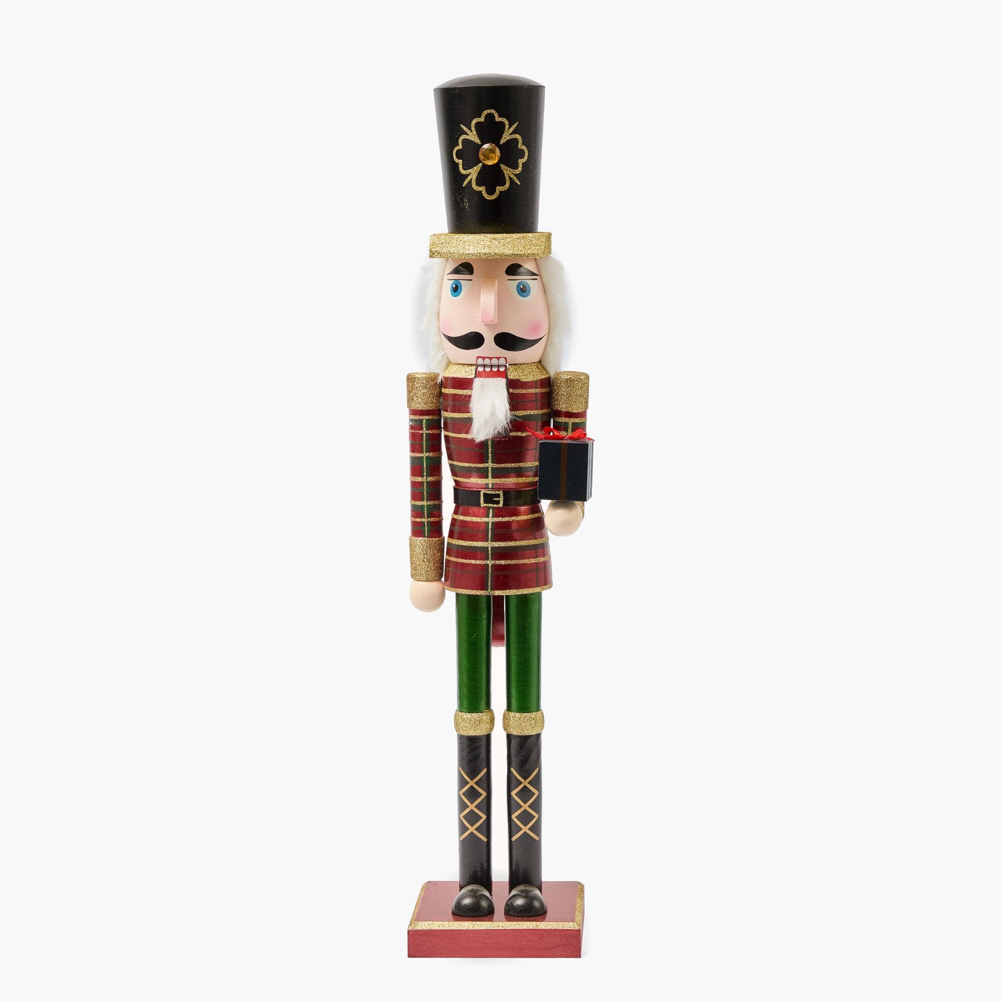 Nutcracker figurine in traditional costume on a white background