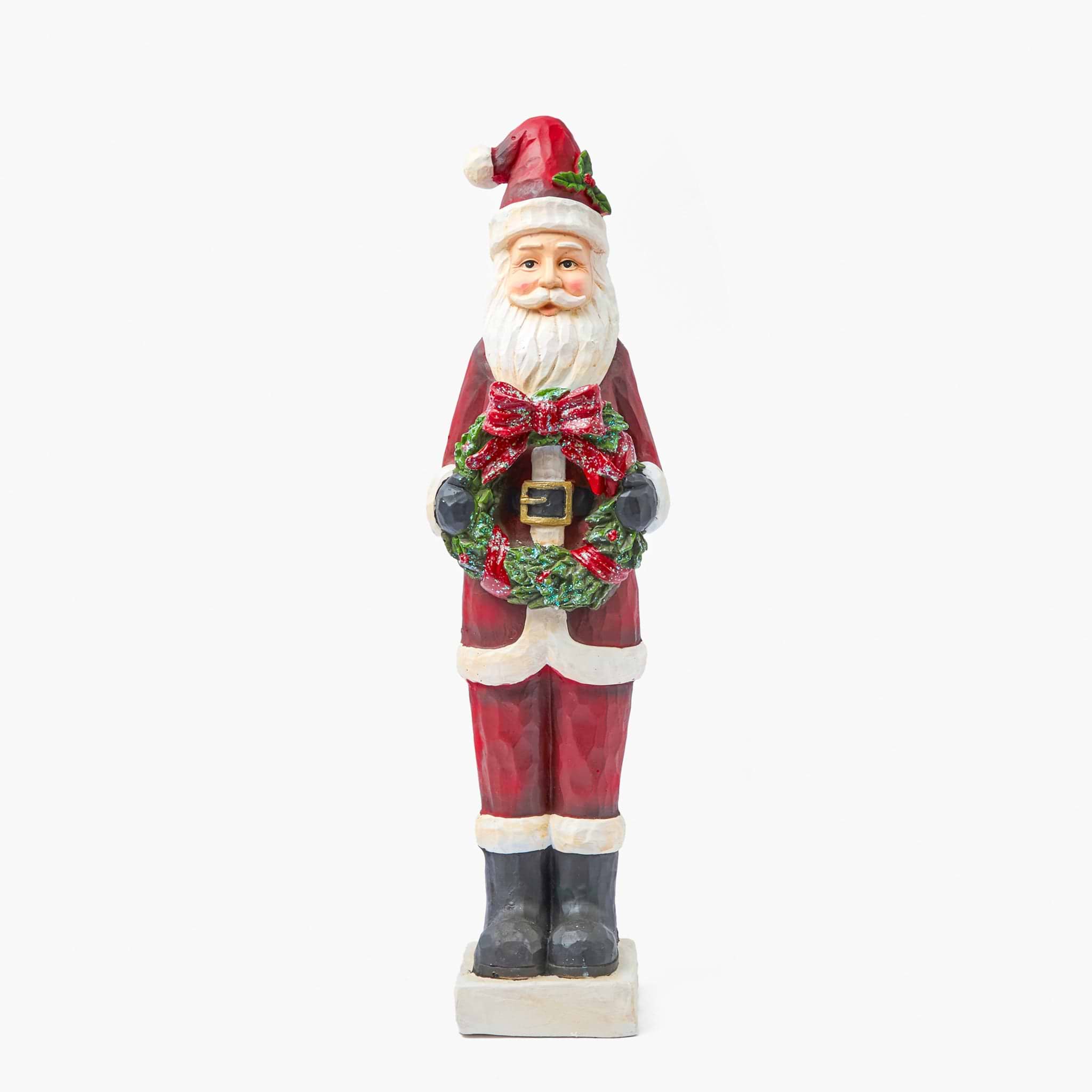 Tall Statue of a Santa Claus holding a wreath on a white background