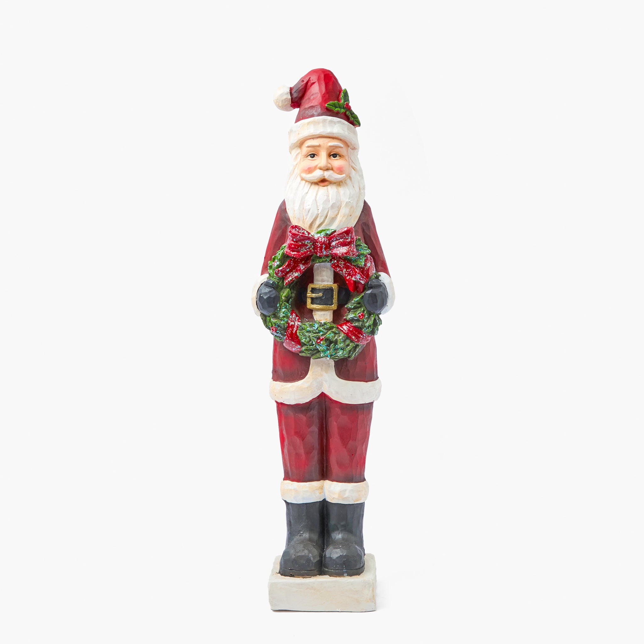 Tall Statue of a Santa Claus holding a wreath on a white background