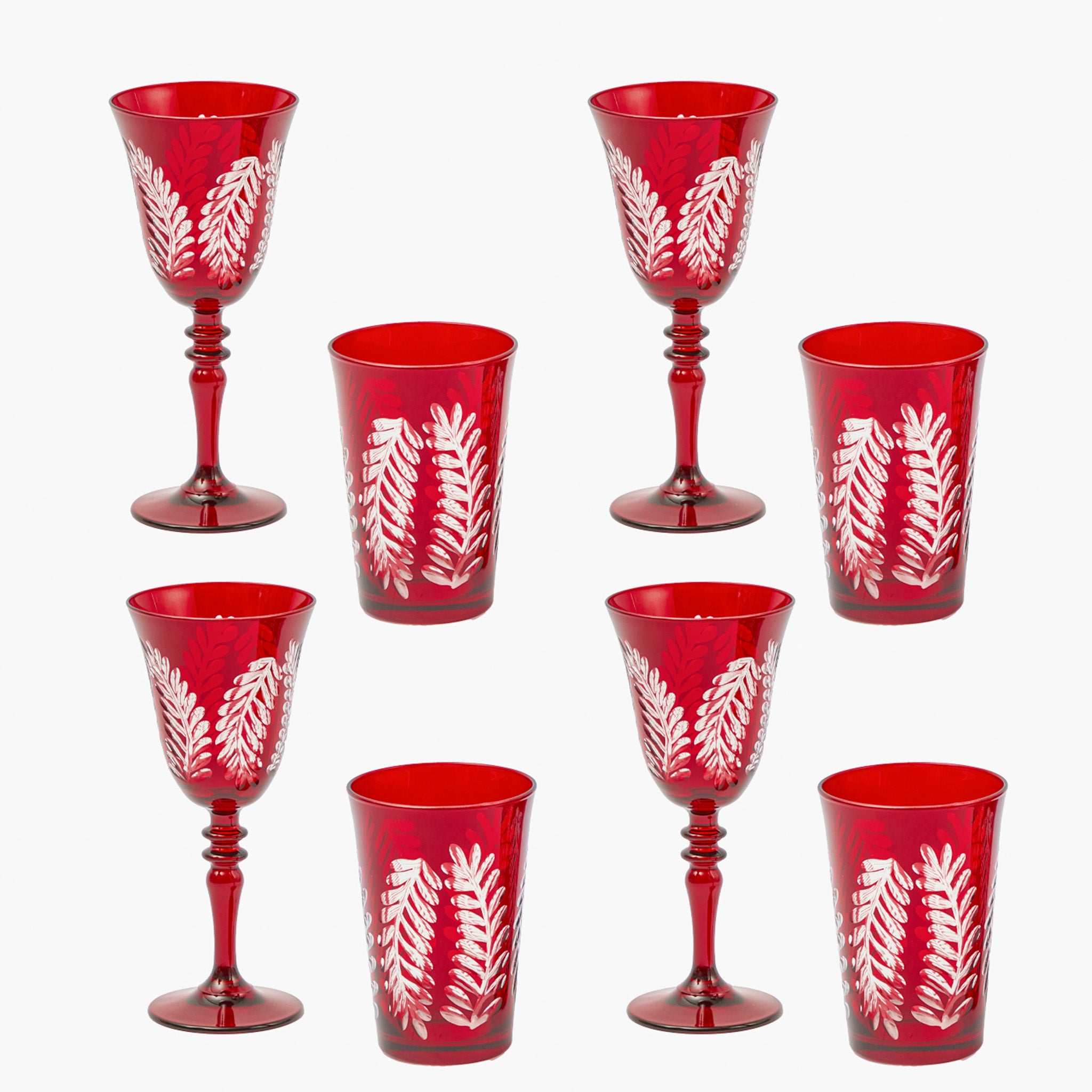 Set of red glasses with white leaf patterns on a white background