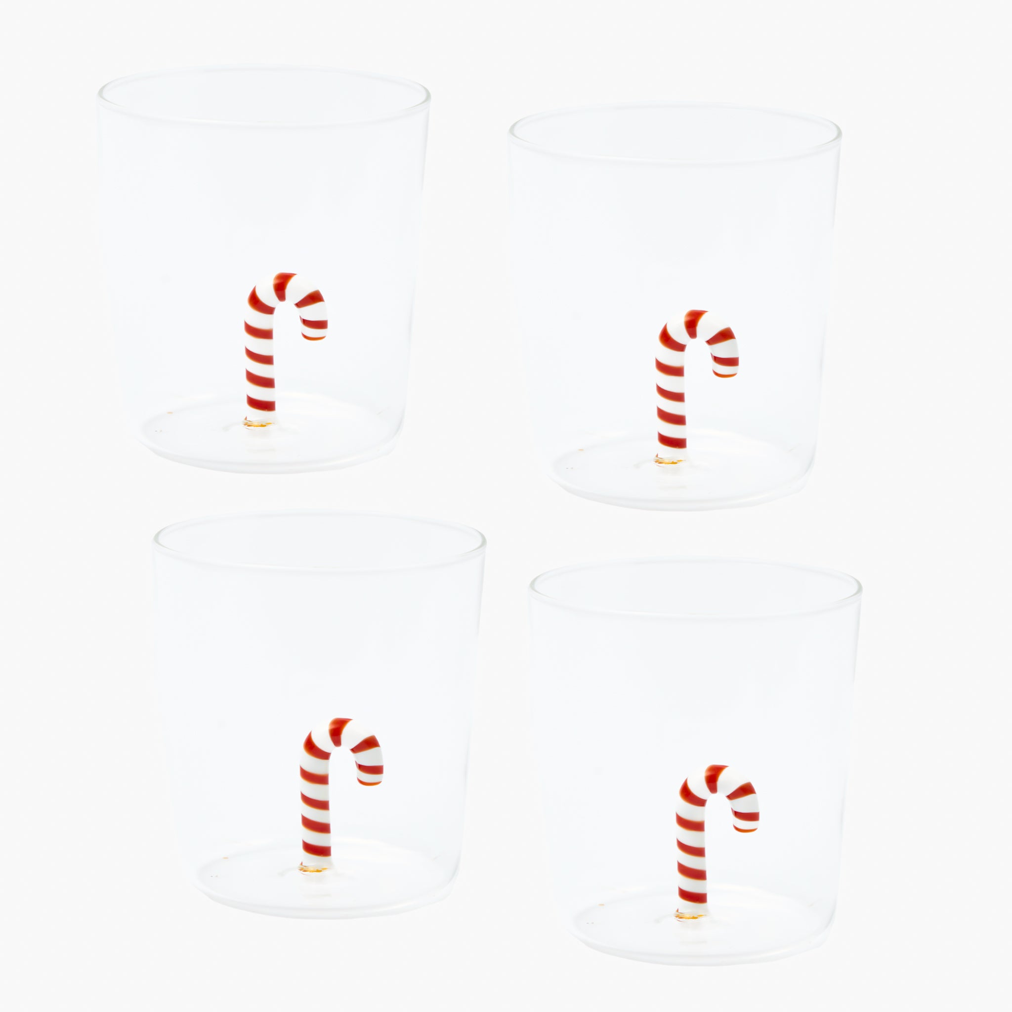Four candy cane-shaped cups on a white background