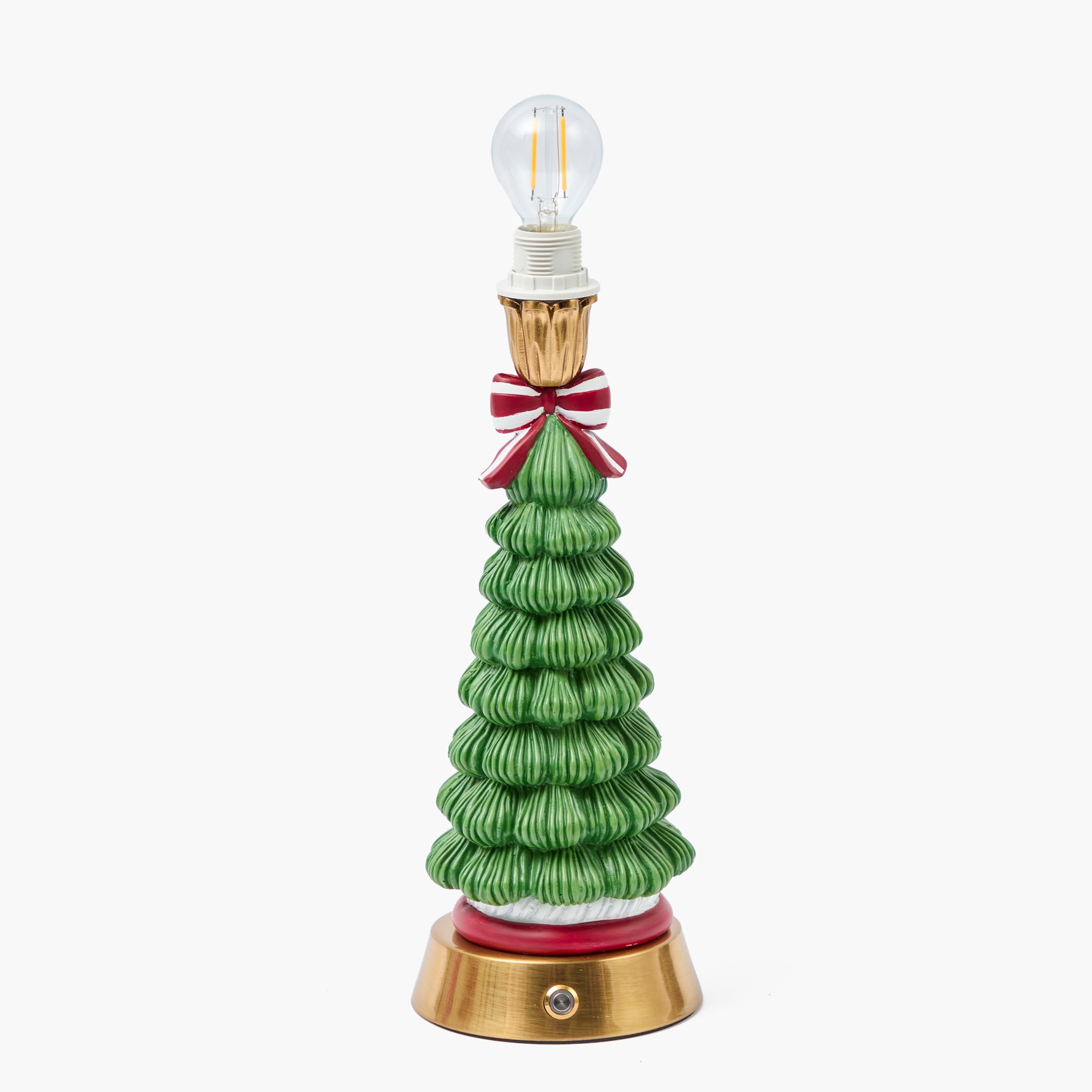 Decorative Christmas tree-shaped lamp with a red bow on a white background
