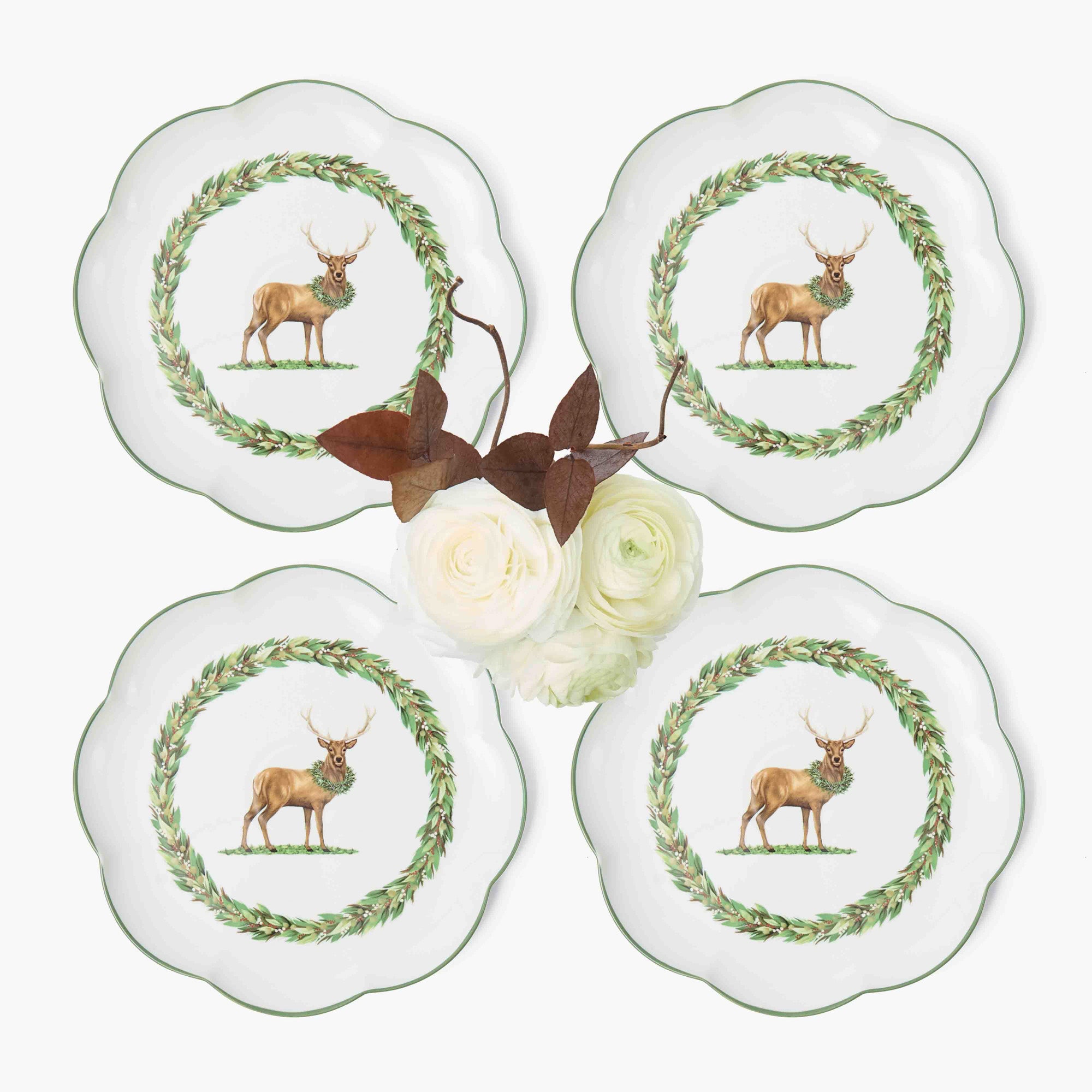 Four decorative plates with deer design on a white background