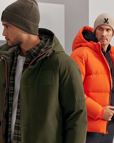 two models from psycho bunny's wearing puffer jackets in khaki and orange