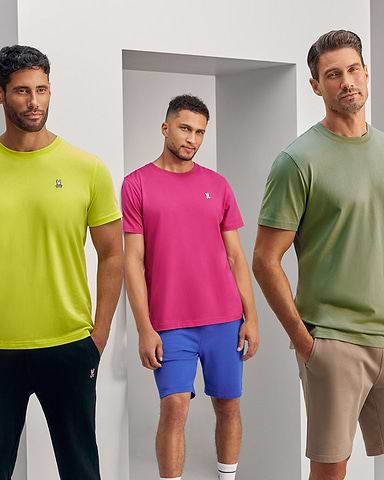 3 models wearing psycho bunny's classic tee in neon yellow, pink and khaki standing