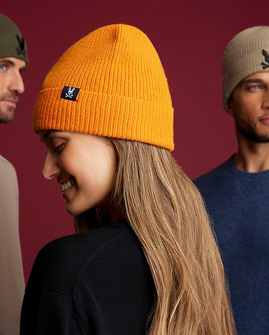 three models, two men and a woman wearing hats