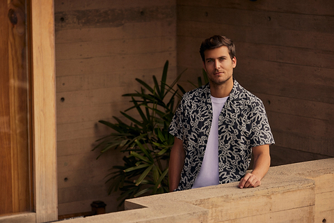 man wearing a shirt and a white tee shirt underneath
