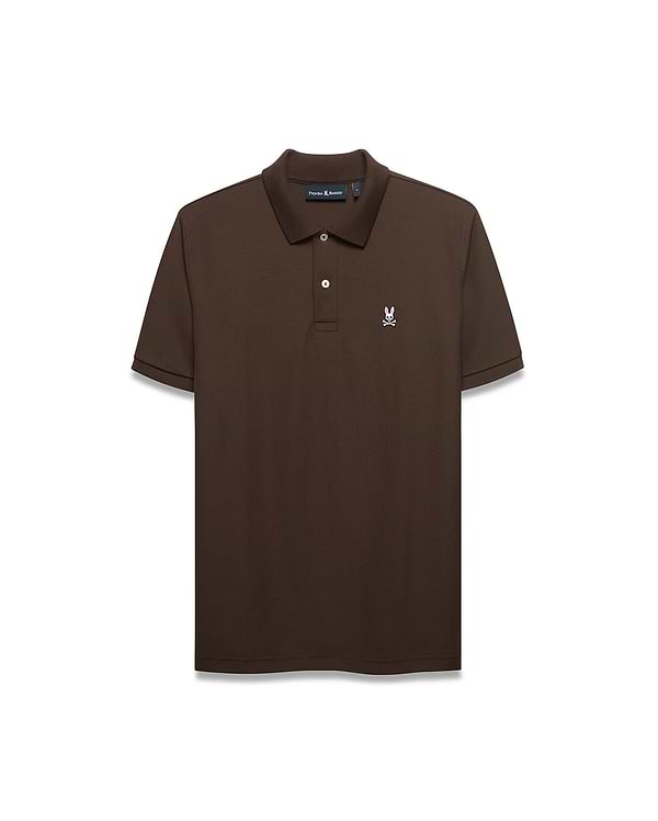 Men's Classic Pima Pique Polo in rich brown pique fabric, featuring a classic fit, two white buttons, and a small embroidered white and pink Psycho Bunny skull logo on the left chest.