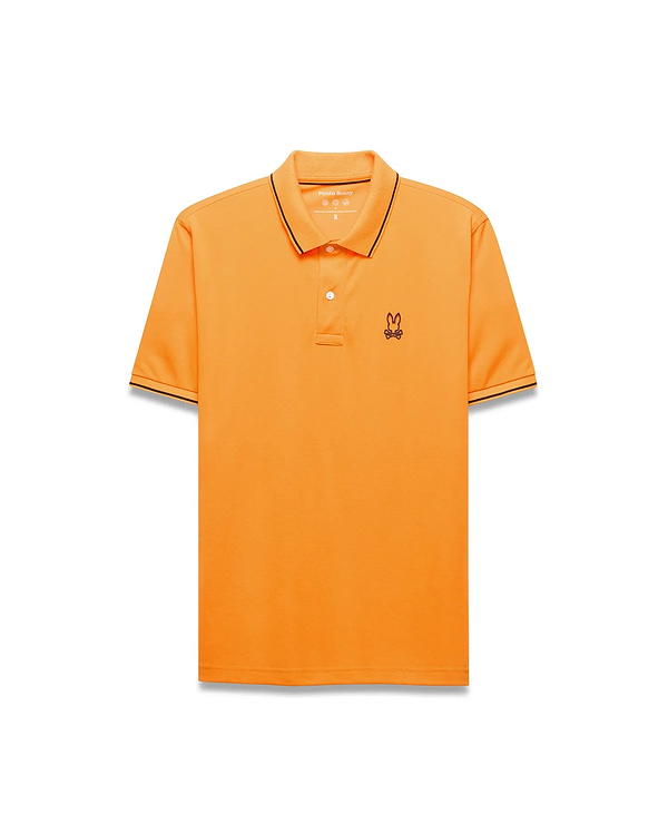 Mens Joji Performance Polo in vibrant orange, featuring a classic fit, smooth jersey fabric, black tipping on the collar and cuffs, and a small embroidered Psycho Bunny skull logo on the left chest.