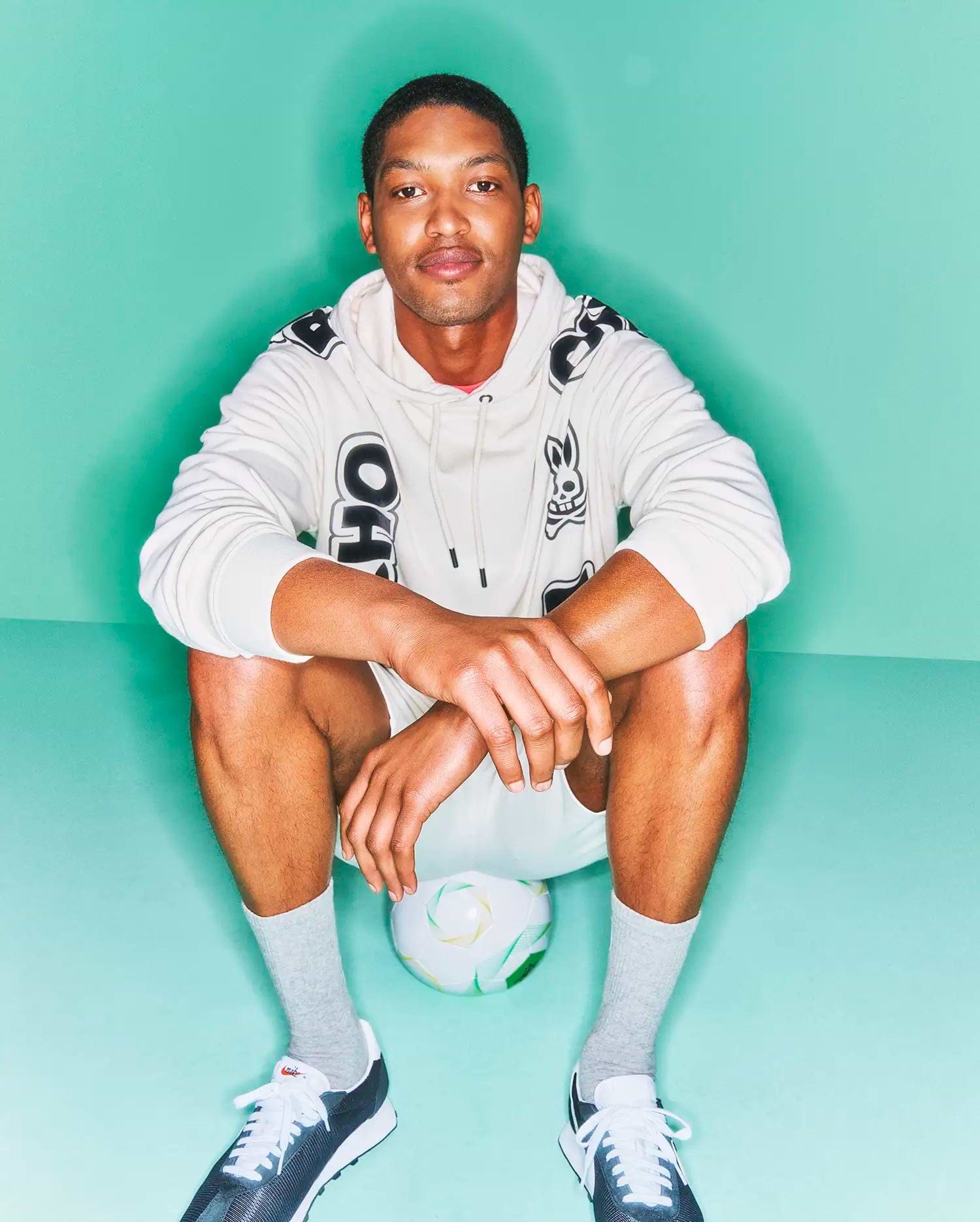 Mens Toby Oversized Hoodie in ecru, crafted from soft French terry, featuring a relaxed fit, bold black Psycho Bunny skull and OH graphics on the front, with repeated branding on the hood and shoulders. (2)