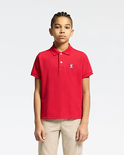 Red kids classic pique polo shirt with a classic fit, featuring a two-button placket, ribbed collar and cuffs, and a small embroidered white Psycho Bunny skull logo on the left chest.
