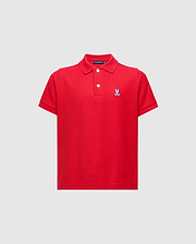 Red kids classic pique polo shirt with a two-button placket, white buttons, and a small, embroidered white, blue, and black Psycho Bunny skull logo on the left chest.