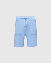 The KIDS TAYLOR LIGHT PIQUE SWEATSHORT by Psycho Bunny, in light blue Pima cotton, features a drawstring waistband, two front pockets, and an embroidered Bunny logo on the right. Ideal for a casual-chic look against a plain background.