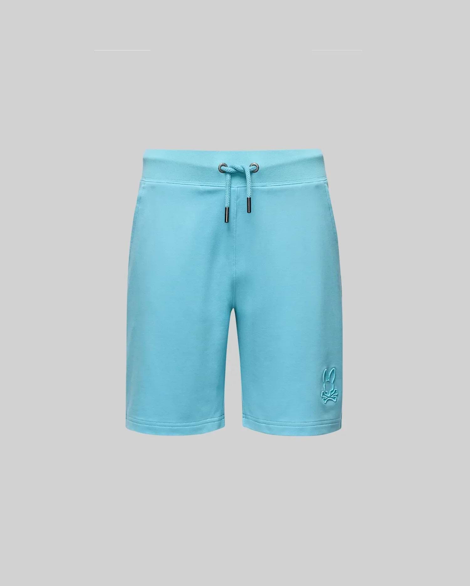 Psycho Bunny KIDS LEVANZO EMBROIDERED MICRO FRENCH TERRY SWEATSHORT - B0R578F200 in light blue offers ultimate comfort, with two metal grommets at the waistband and an embroidered bunny logo near the bottom left hem, shown on a gray background.