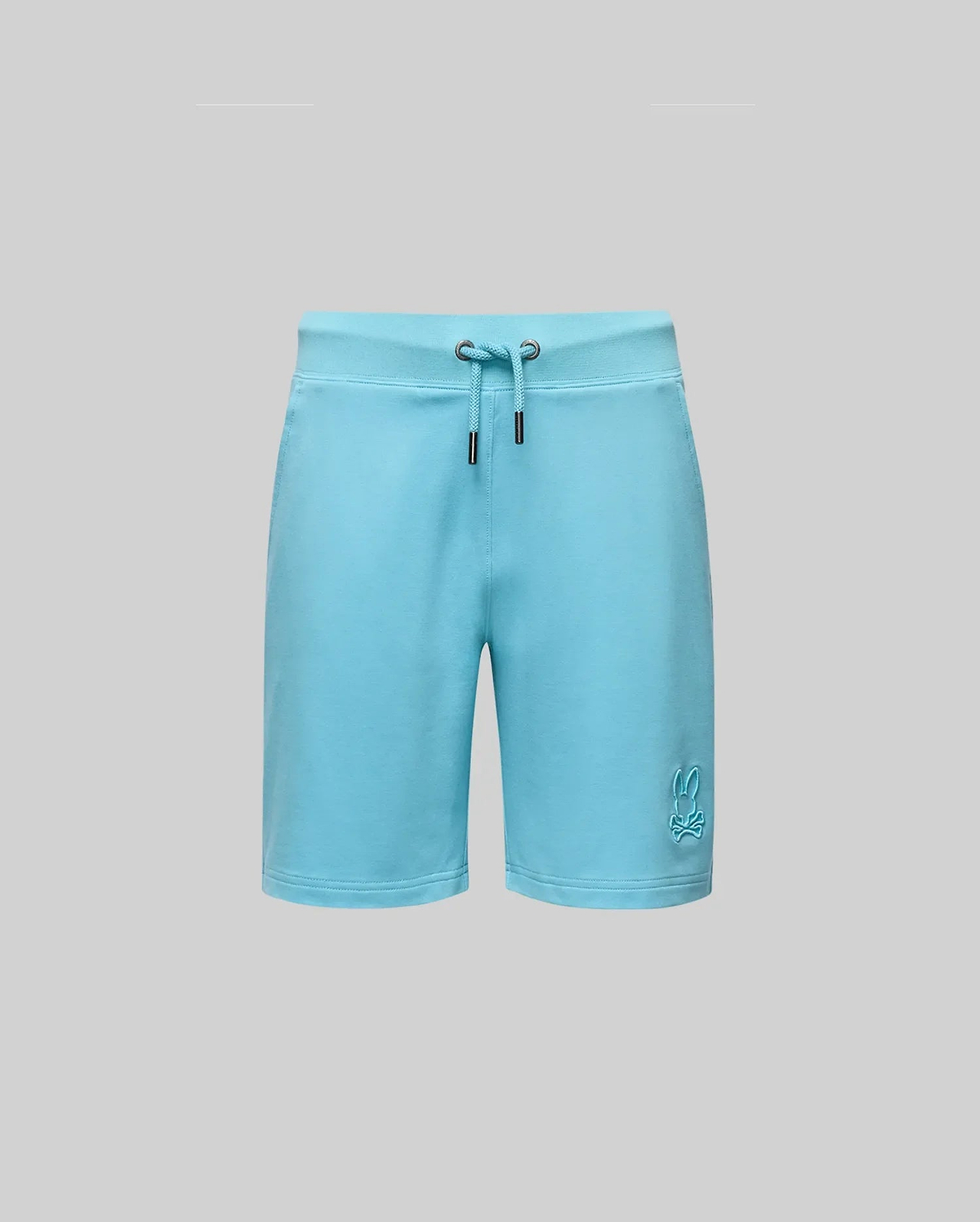 Psycho Bunny KIDS LEVANZO EMBROIDERED MICRO FRENCH TERRY SWEATSHORT - B0R578F200 in light blue offers ultimate comfort, with two metal grommets at the waistband and an embroidered bunny logo near the bottom left hem, shown on a gray background.