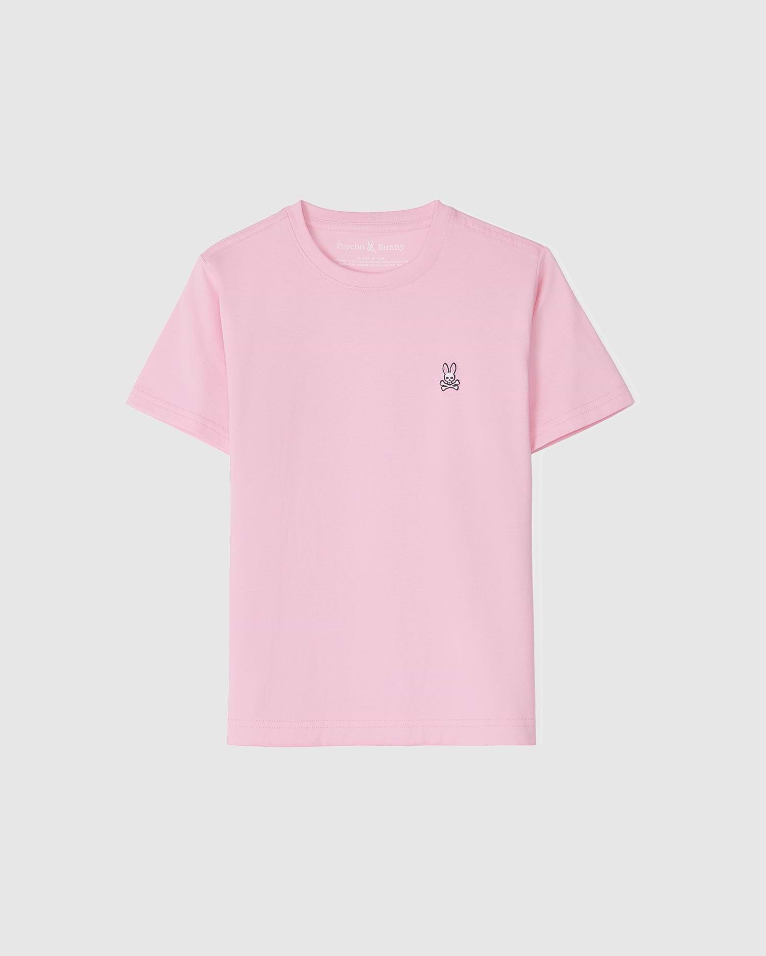 The KIDS CLASSIC CREW NECK TEE - B0U014CRPC by Psycho Bunny is a light pink kids' tee made of 100% Pima cotton. It features a small embroidered bunny logo on the upper left against a white background, offering comfort and style for back-to-school outfits.