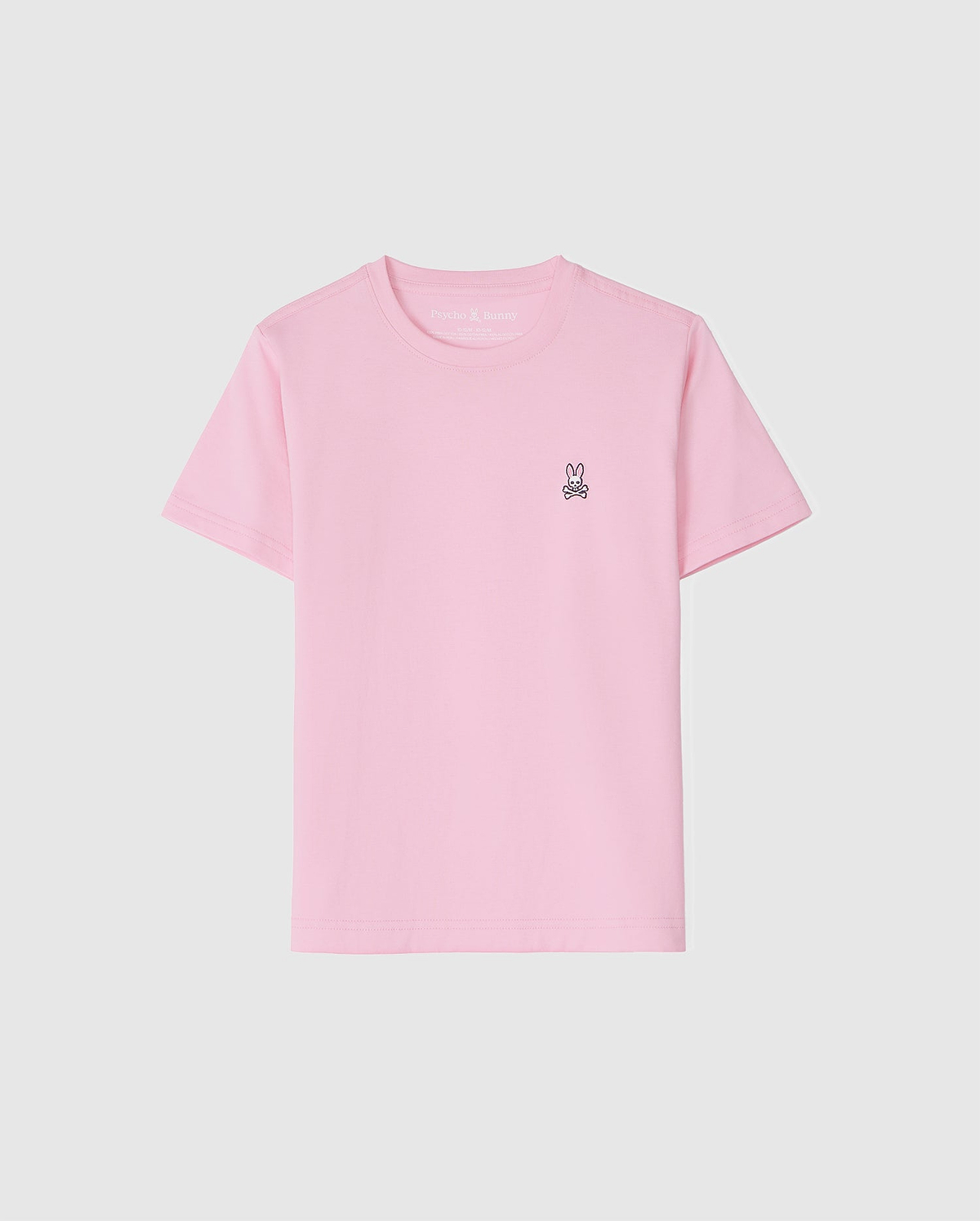 The KIDS CLASSIC CREW NECK TEE - B0U014CRPC by Psycho Bunny is a light pink kids' tee made of 100% Pima cotton. It features a small embroidered bunny logo on the upper left against a white background, offering comfort and style for back-to-school outfits.