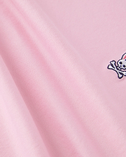 The Psycho Bunny KIDS CLASSIC CREW NECK TEE - B0U014CRPC is made of 100% Pima cotton, showcasing a pink fabric with an embroidered skull and crossbones. It offers a smooth texture and soft look, ideal for back-to-school outfits.