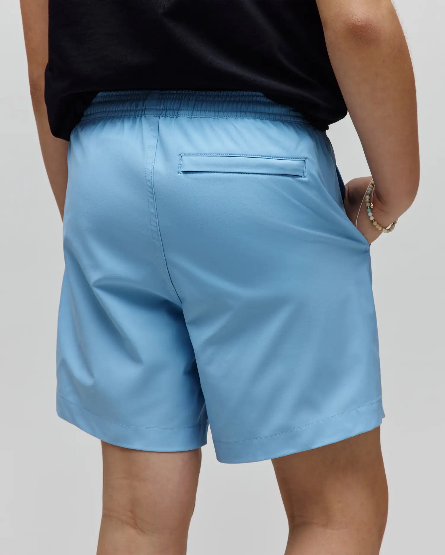 Kids Samos Hydrochromic Printed Swim Trunk in light blue, featuring a relaxed fit, smooth quick-dry fabric, elastic waistband, and a subtle back welt pocket.