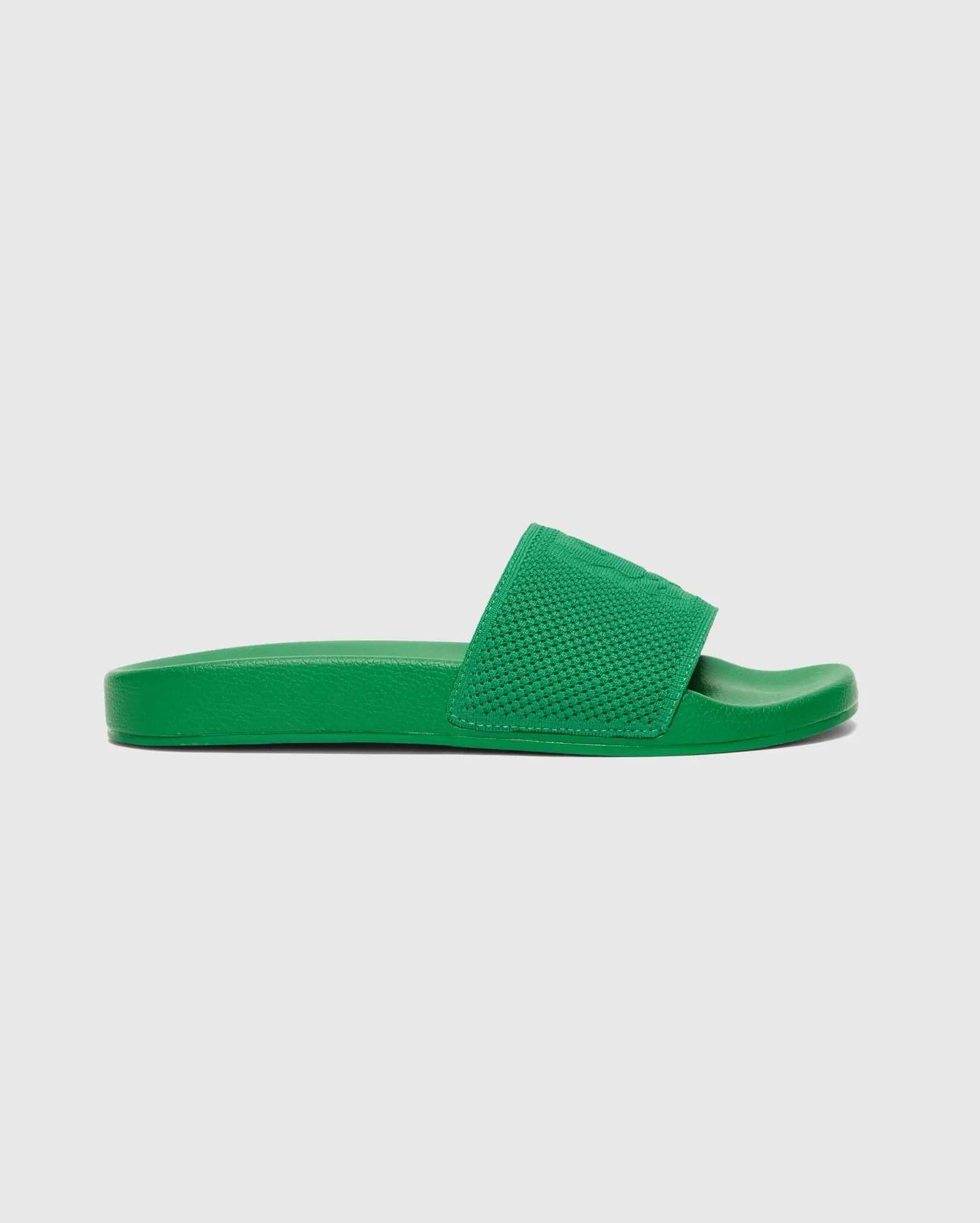Mens Knit Slides in a vibrant green, featuring a textured knit strap with a subtly embossed Psycho Bunny skull logo, offering a bold streetwear aesthetic.