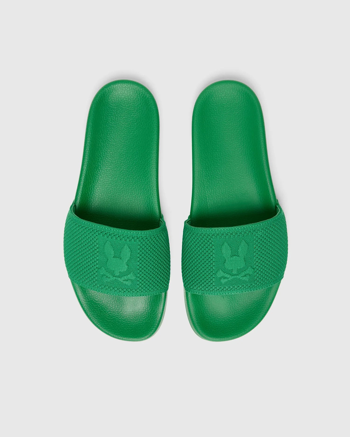 Vibrant green Mens Knit Slides featuring a textured knit strap with a prominent embossed Psycho Bunny skull logo and a comfortable, textured footbed.