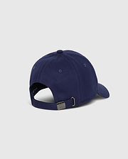 The Psycho Bunny MENS CLASSIC BASEBALL CAP - B6A816A1HT in classic navy blue is shown from the back, highlighting its six-panel cotton twill construction. It includes a curved brim and an adjustable metal strap for sizing, elegantly placed on a plain, light gray surface.