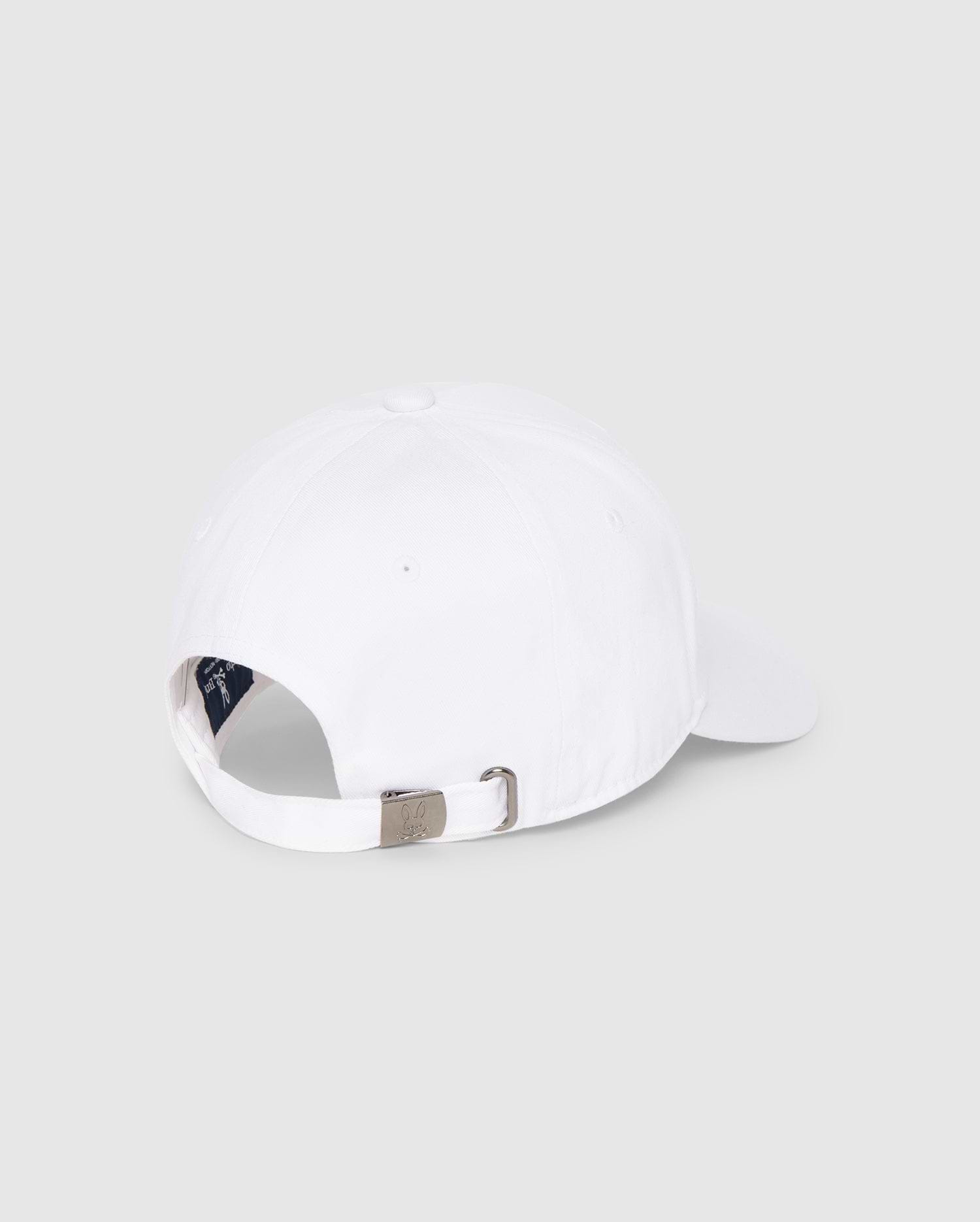 This is a rear view of the MENS CLASSIC BASEBALL CAP - B6A816A1HT from Psycho Bunny, showcasing an adjustable strap with a metallic buckle for a customized fit and a small opening above the strap. The interior of the cap is partially visible against a plain, light gray background.