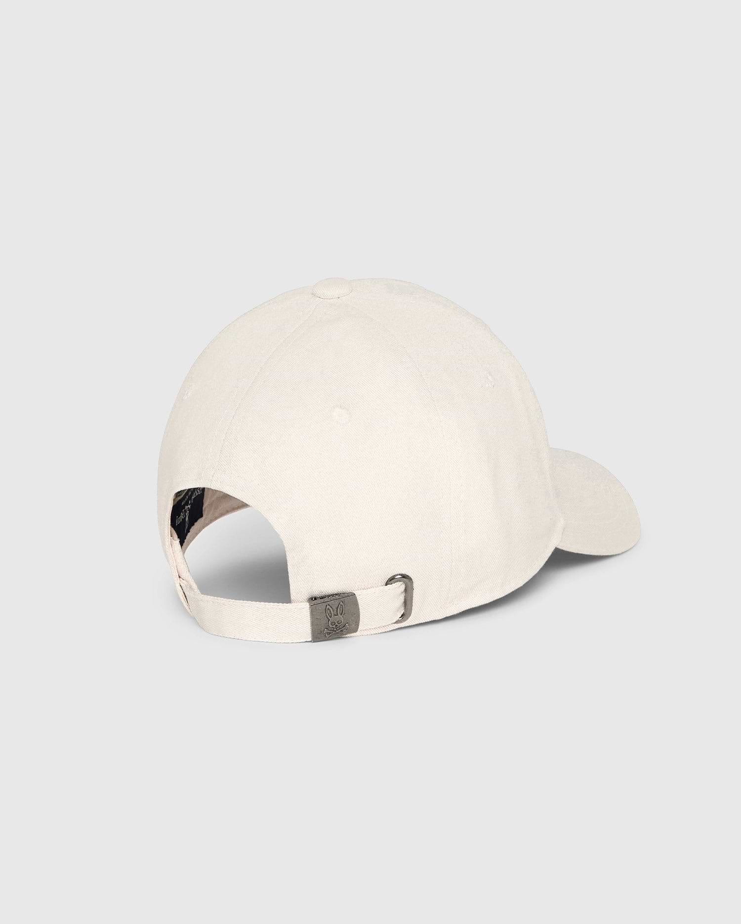 The Psycho Bunny MENS CLASSIC BASEBALL CAP - B6A816B200 is displayed from the back, revealing its adjustable strap with a metal buckle. Crafted from 100% cotton in light color, it symbolizes classic accessory style against a plain light-gray background.